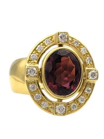 Oval Cut Garnet with Diamond Halo Cocktail Ring in 18 Karat Yellow Gold