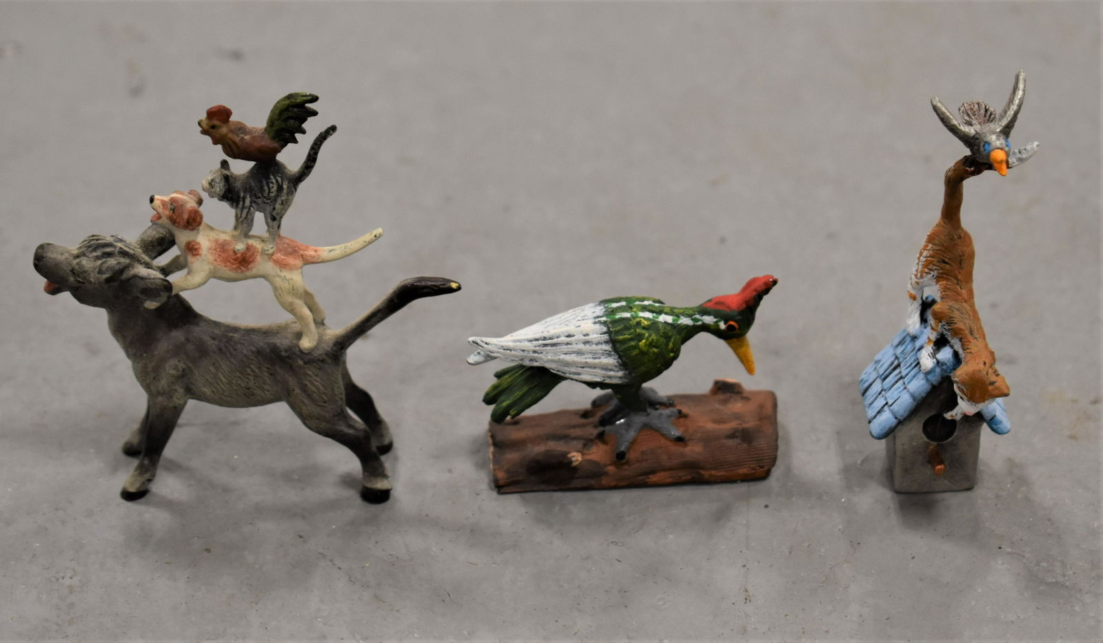 Lot (3) Cold Painted Animals: (1) 2 1/4" T COLD PAINTED AUSTRIA BRONZE OF DONKEY WITH DOG, CAT AND ROOSTER ON HIS BACK - (1) 1 1/2" COLD PAINTED WOOD PECKER MARKED SPAIN ON BOTTOM AND 2 1/2" COLD PAINTED BIRD HOUSE WITH CAT WITH B