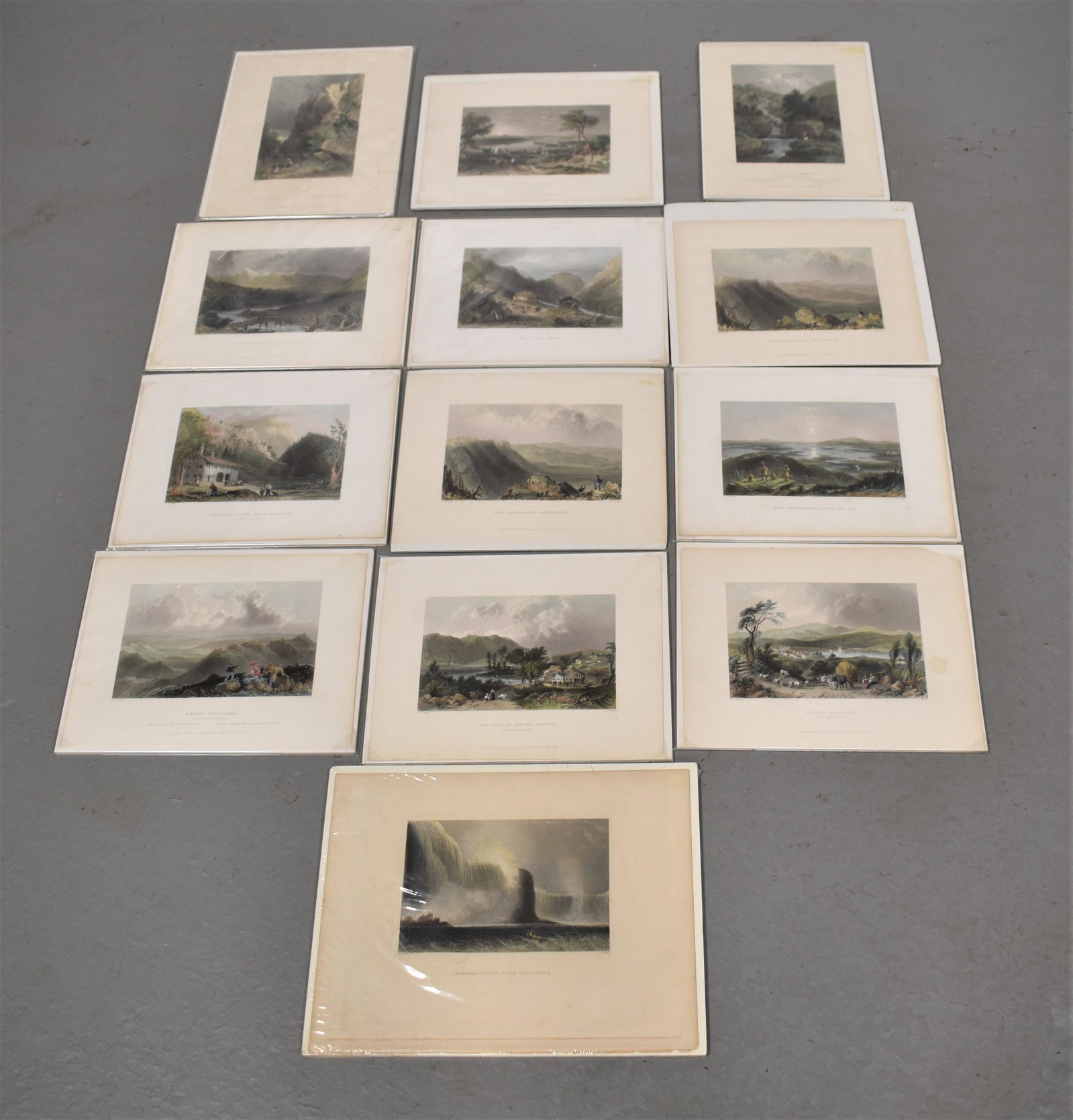 Lot 13 19th Century Colored Prints: (12) WILLIAM BARTLETT COLORED PRINTS, (7) MOUNT WASHINGTON AND LAKE WINNIPESAUKEE, (1) NIAGRA FALLS AND (1) WHITE MOUNTAINS BY T DOUGHTY- VARIOUS SIZES- ALL UNFRAMED BUT SHRINK WRAPPED- TONING, FOXING