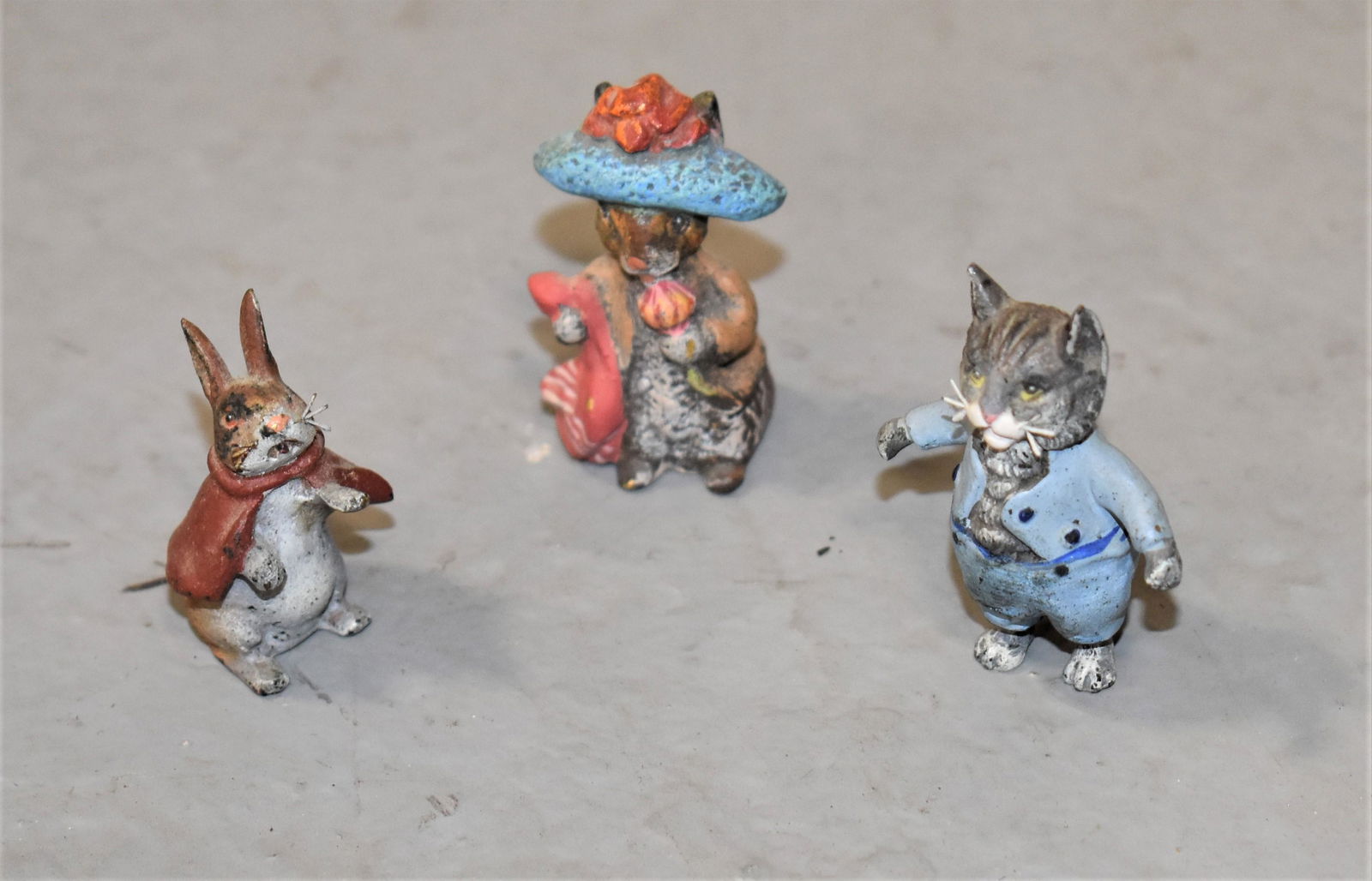 (3) Miniature Cold Painted Beatrix Pottery Figures: 1 1/4" TOM KITTEN, 1 1/4" BENJAMIN BUNNY AND 1 1/8" HEYDE RABBIT WITH RED CAPE- 20TH CENTURY AUSTRIAN- WEAR AND IMPERFECTIONS