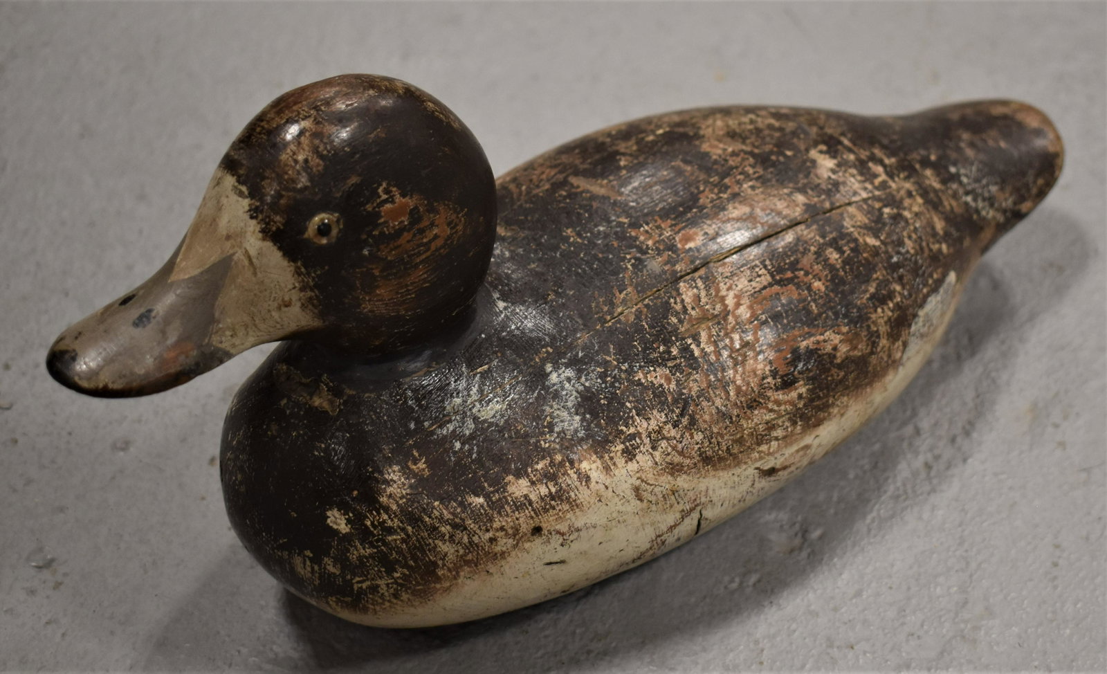 Carved and Painted Broadbill Decoy: VINTAGE PAINTED AND CARVED WOODEN MASON BROADBILL DECOY WITH GLASS EYES - FEMALE 13 1/2" LONG - WEAR AND LOSSES TO PAINT - SPLITS AND REPAIRS AT THE NECK