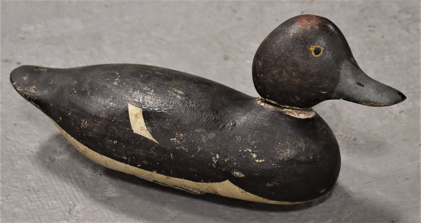 Carved and Painted Broadbill Decoy: VINTAGE MASON CARVED AND PAINTED BROADBILL DECOY - 13 1/2" LONG - WEAR AND LOSSES TO PAINT - DAMAGE TO NECK - HEAD LOOSE - IMPERFECTIONS