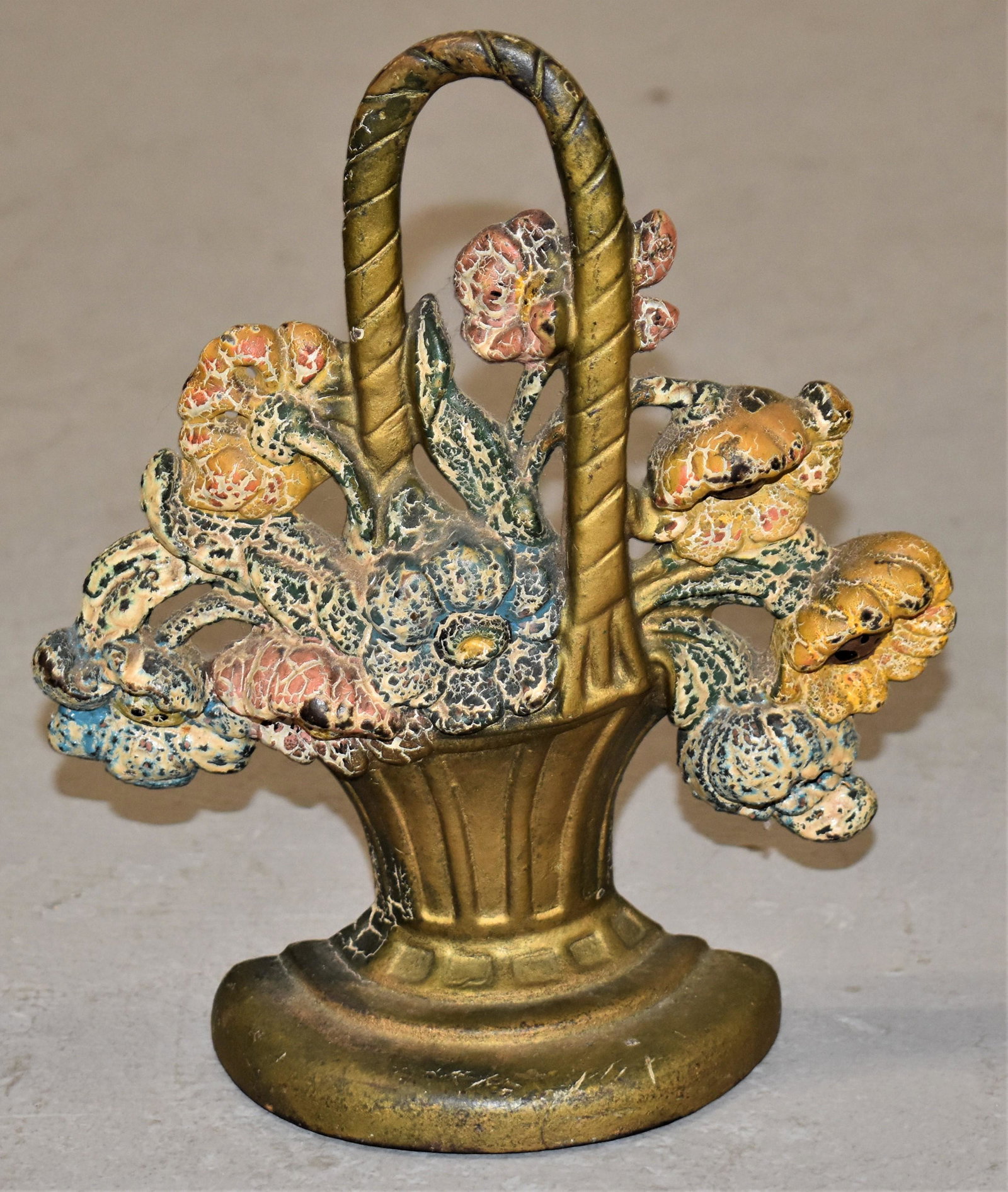Hubley Basket of Flowers Cast Iron Doorstop: 8 1/4" PAINTED CAST IRON BASKET OF FLOWERS DOORSTOP - NO. 42 - WEAR, LOSSES TO PAINT AND IMPERFECTIONS