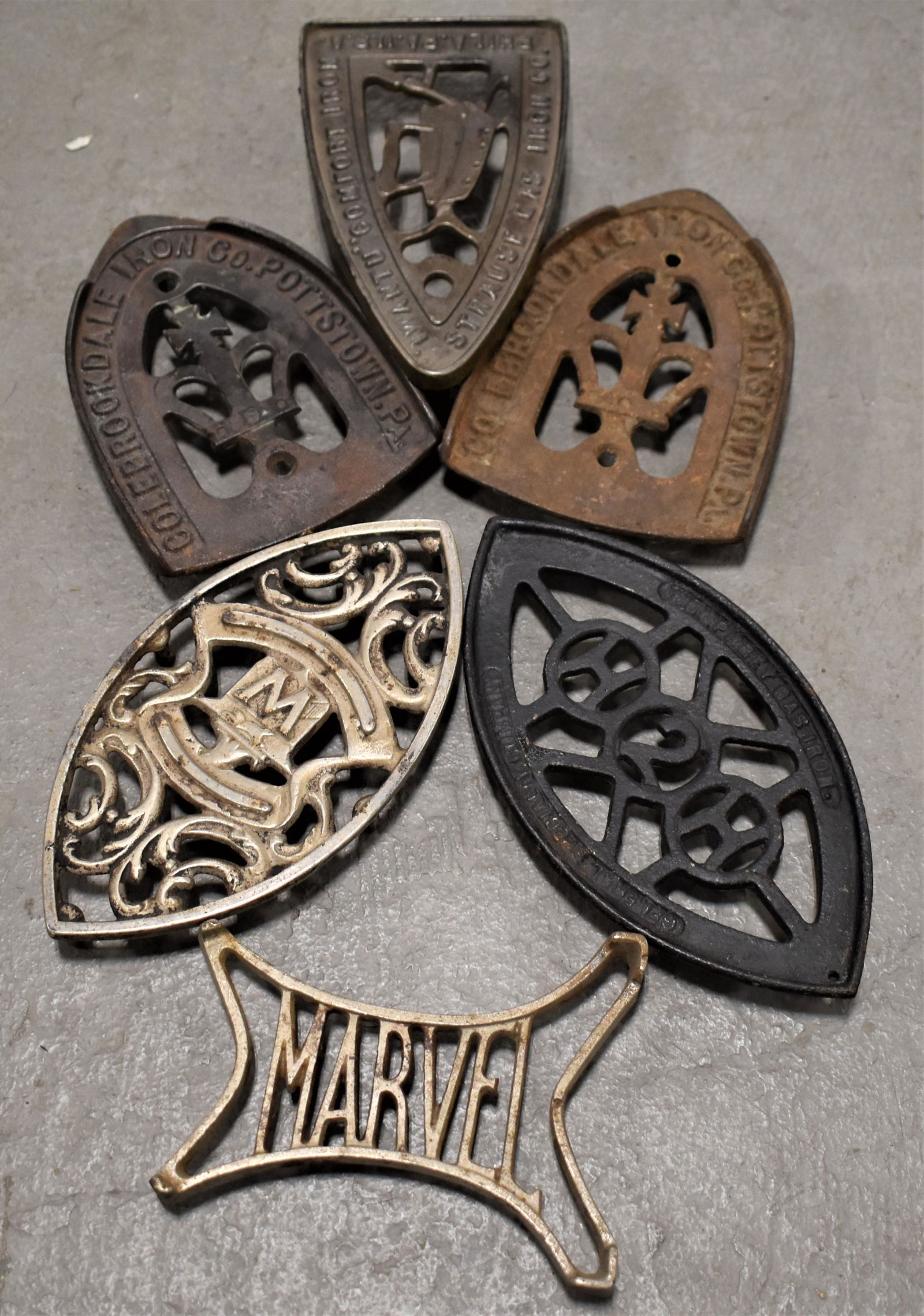 Lot (6) Advertising Cast Iron Trivets: (2) COLEBROOKDALE STRAUSE GAS IRON CO., HUMPHREY GAS IRON/GEN SPECIALTY CO., MARVEL AND (1) WITH W AND RUNNING FOX - IMPERFECTIONS