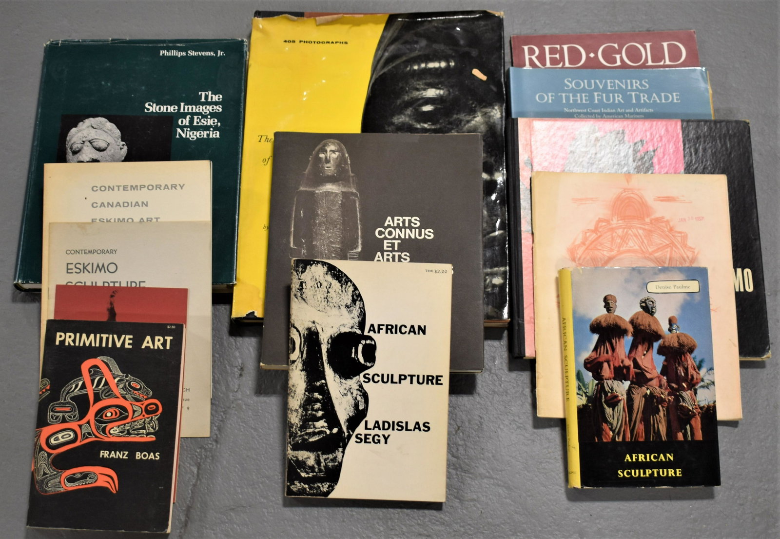 13 Vol. of Books on Tribal Arts: SOUVENIRS OF THE FUR TRADE BY MALLOY,2000 - RED,GOLD-COPPER ARTS OF AFRICA,1984 - THE STONE IMAGES OF ESIE,NIGERIA BY STEVENS,1978,WITH DUST JACKET - USED, IMPERFECTIONS
