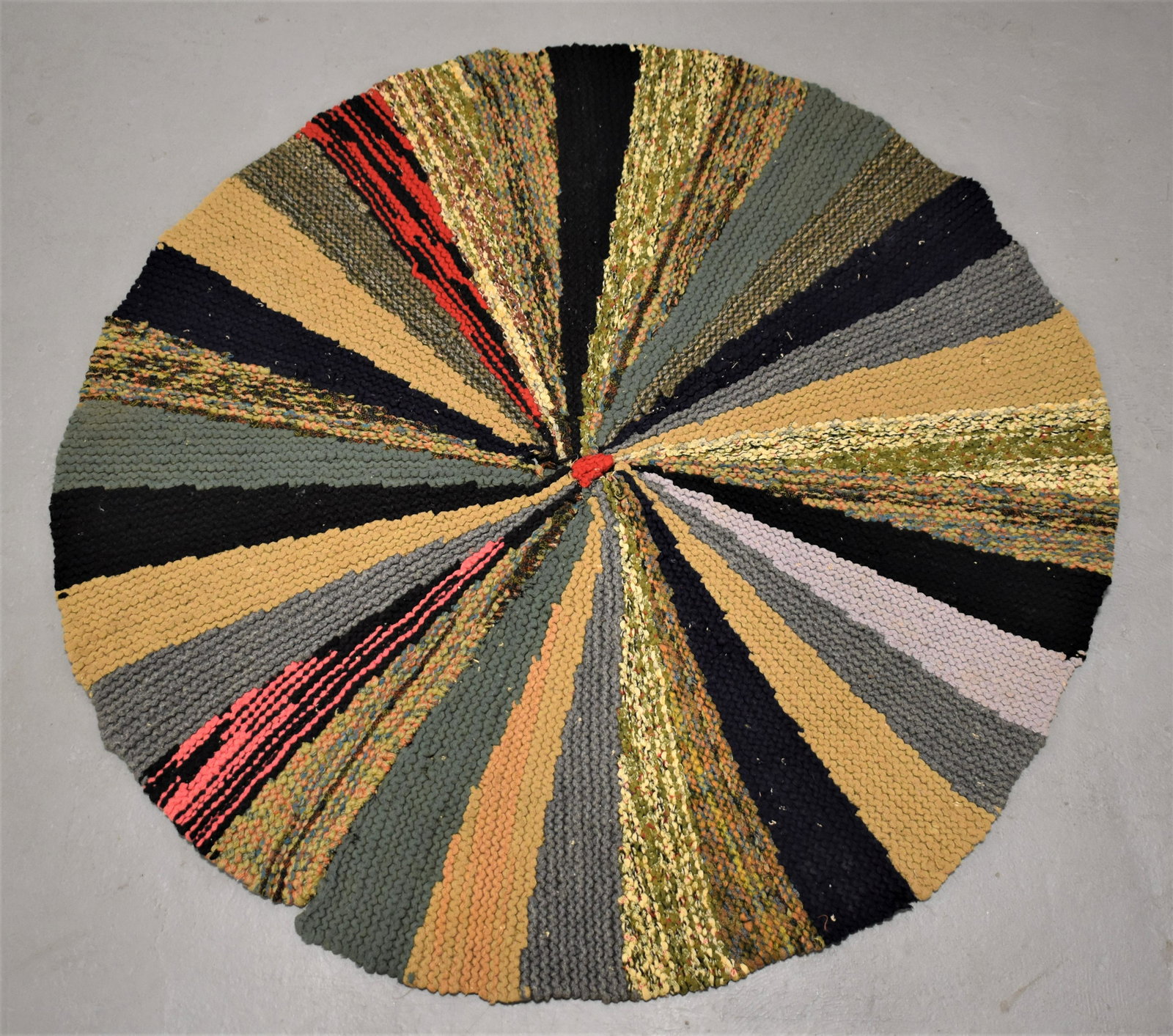 Multi Colored Round Pinwheel Hooked Rug: LATE 19TH CENTURY EARLY 20TH CENTURY MULTI COLORED ROUND HOOKED RUG WITH PINWHEEL DESIGN - 42"DIA - DAMAGED CENTER AND OTHER SMALL SPOTS, WEAR AND IMPERFECTIONS