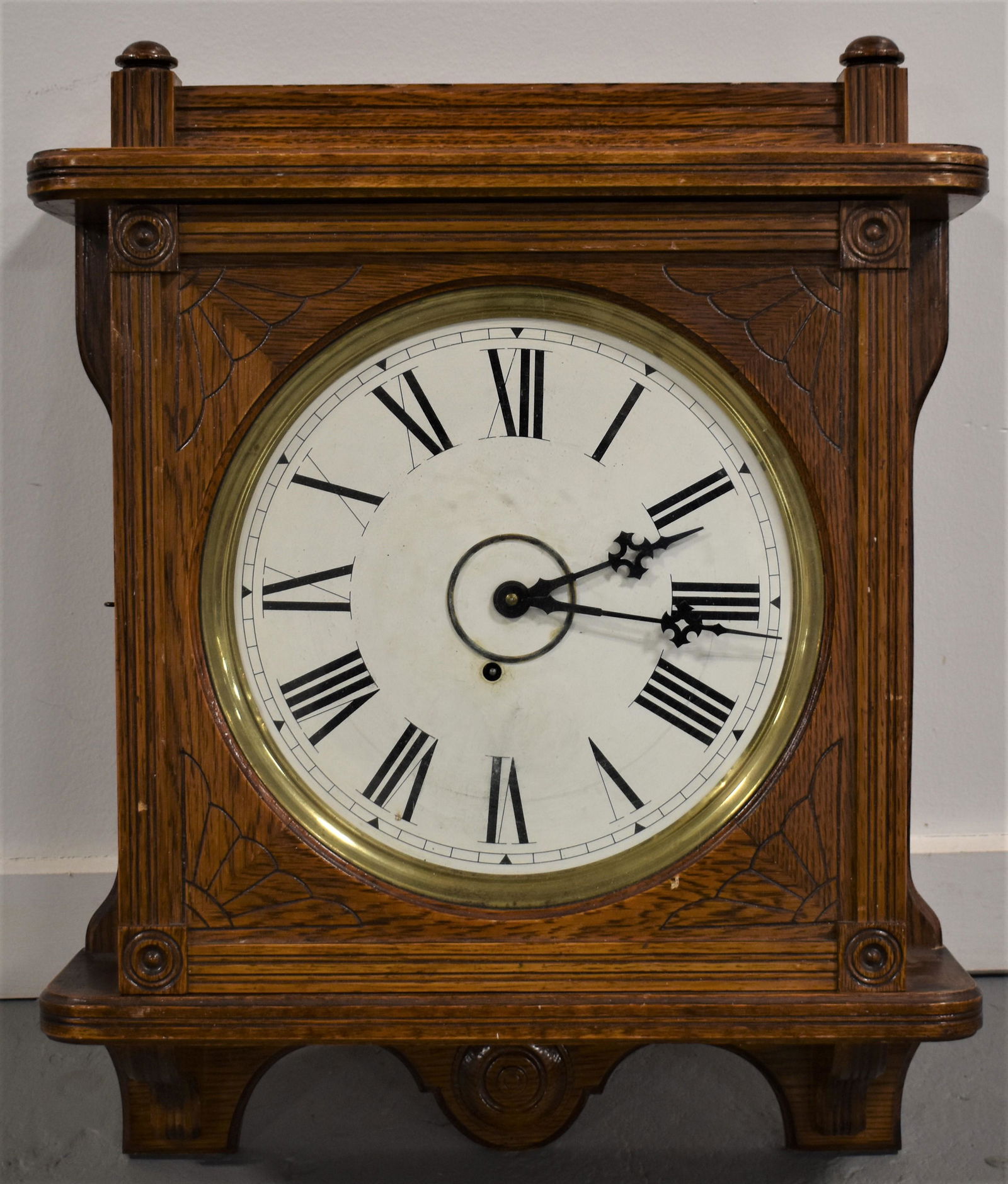 Seth Thomas Lobby Clock: OAK CARVED SETH THOMAS LOBBY CLOCK WITH PRESS CARVED DESIGN AND CORBELS - 30 DAY - 24" X 19" - FACE 11" DIAL - INSTRUCTION LABEL ON BACK - WEAR AND IMPERFECTIONS