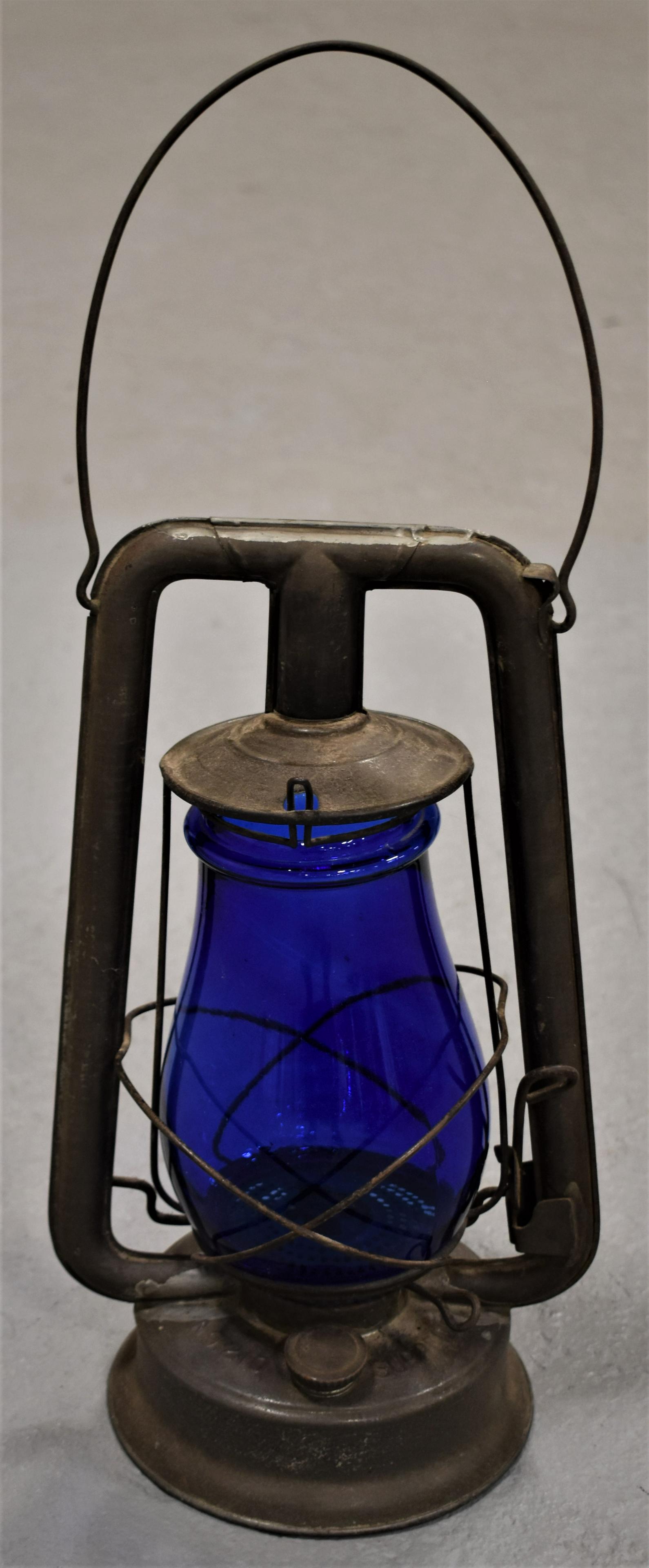 Embury Supreme No. 210 Barn Lantern: VINTAGE TIN BARN LANTERN WITH COBALT GLOBE - EMBURY MFG. CO. WARSAW NY - SUPREME NO. 210 - 13"T X 19"W W/ BAIL HANDLE - WEAR, OXIDATION AND IMPERFECTIONS
