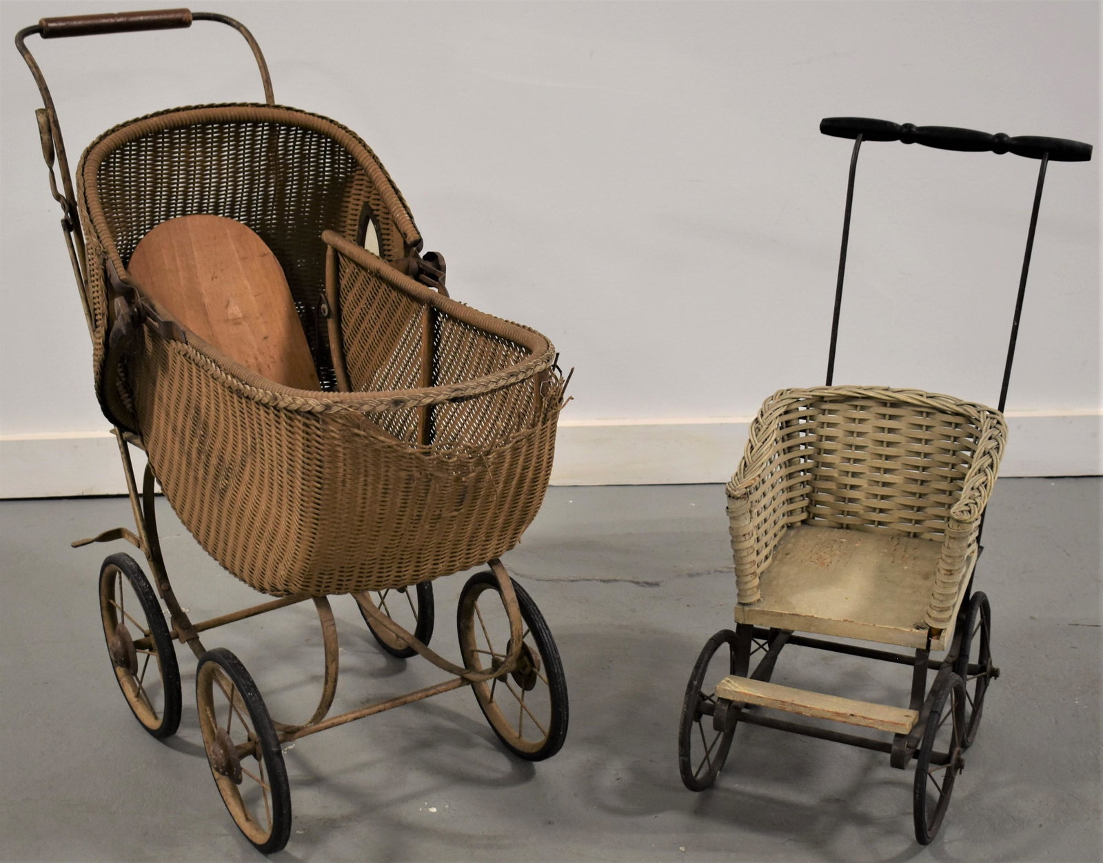Childs Wicker Doll Strollers: (2) VICTORIAN CHILDS DOLL STROLLERS- (1) WHITE W/ OPEN FRONT AND (1) NATURAL FINISH W/ HOOD DAMAGE AND IMPERFECTIONS