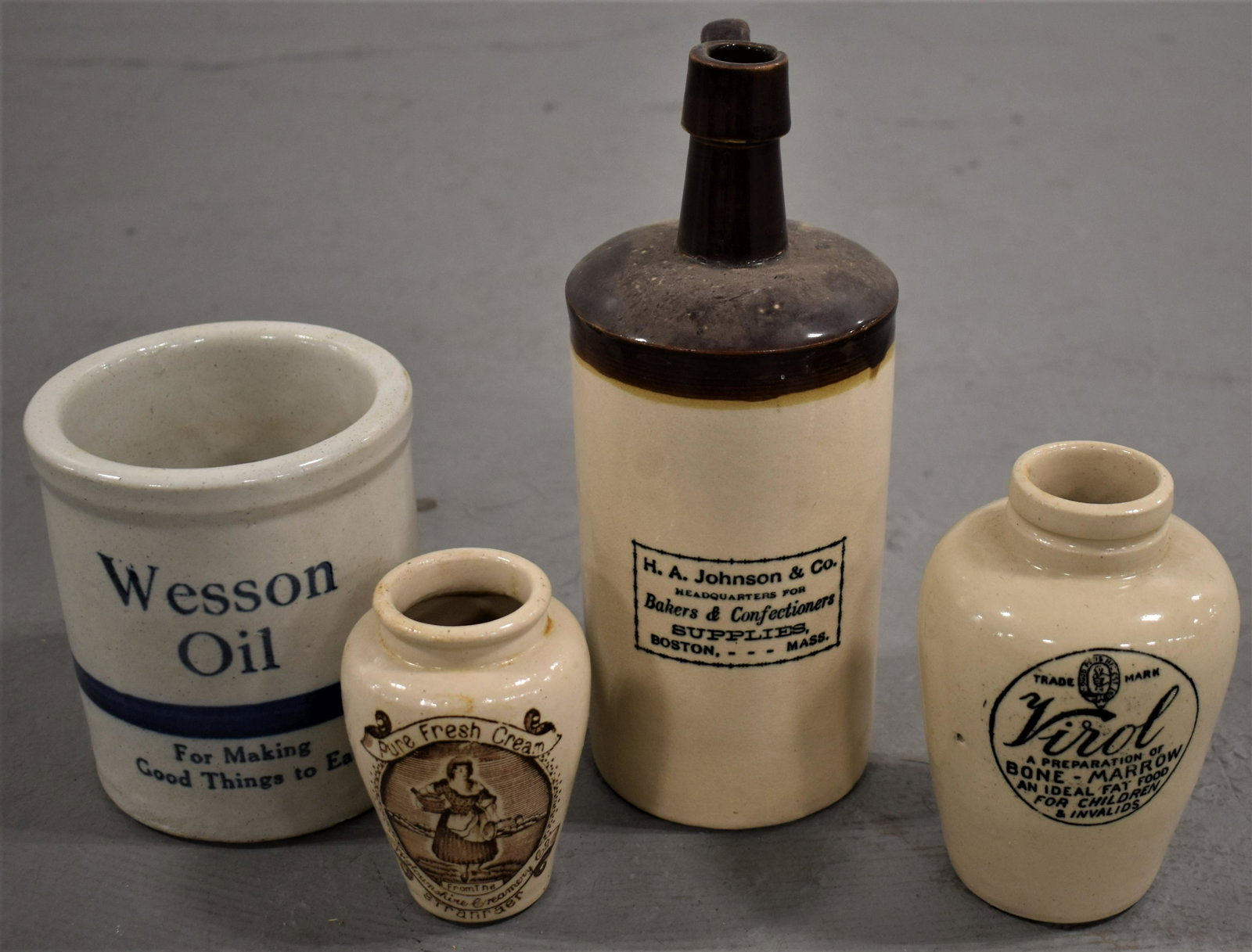 (4) Pottery Advertising Bottles and Jars: LOT (4) STONEWARE POTTERY BOTTLES AND JARS - 9 1/2" H. A. JOHNSON AND CO. BOTTLE - 5 1/4" WESSON OIL CYLINDRICAL JAR - WEAR AND IMPERFECTIONS