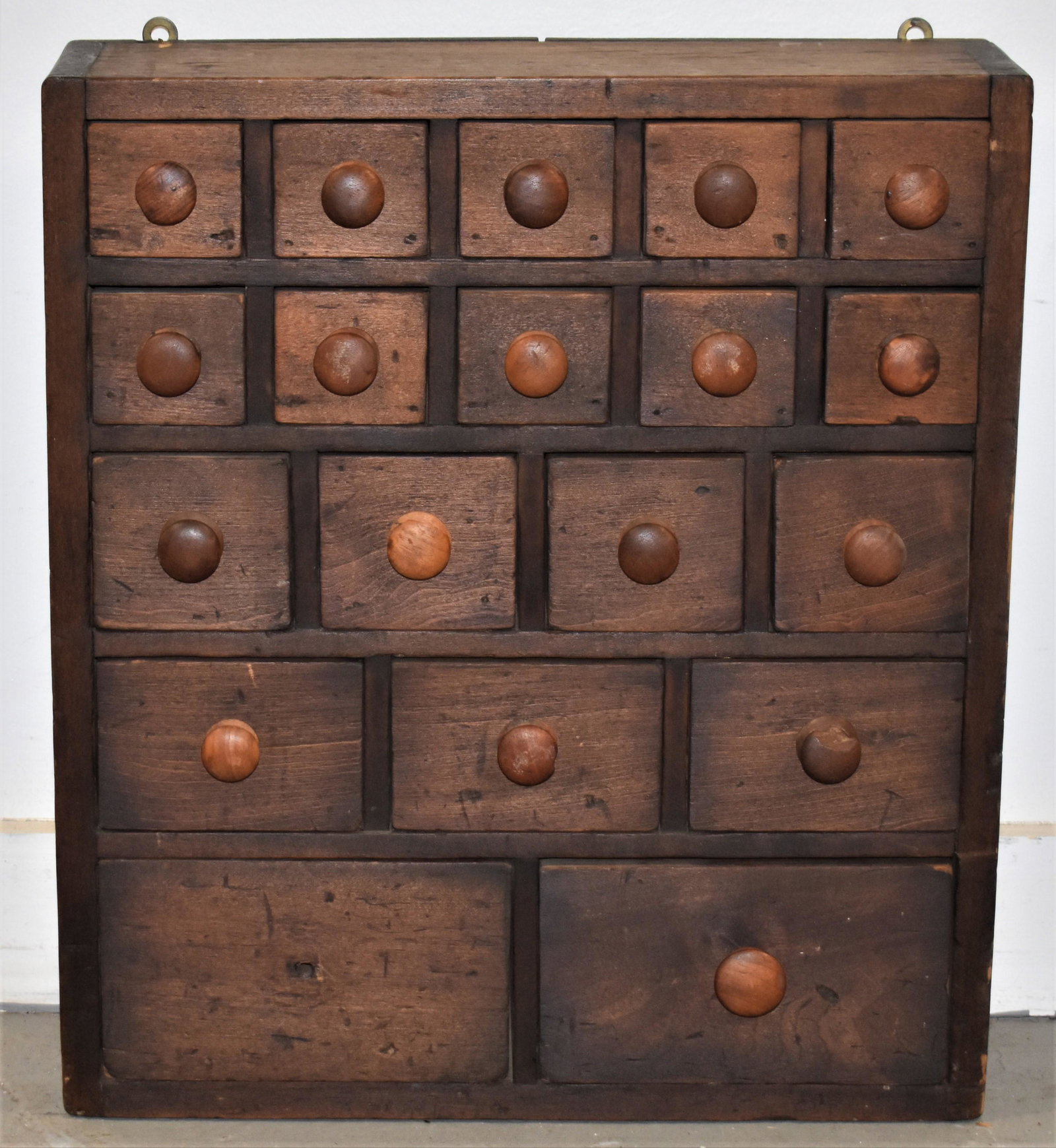 19th Century Pine 19 Draw Apothecary Cabinet: 19TH CENTURY PINE MULTI DRAW TABLE TOP APOTHECARY CABINET - (10) 2 1/2" DRAWERS OVER (4) 3 1/4" DRAWERS OVER (3) 4 1/2" DRAWERS OVER (2) 7 1/2" DRAWERS - IN OLD DARK FINISH - 18"T X 16"W X 5"D - MISSI