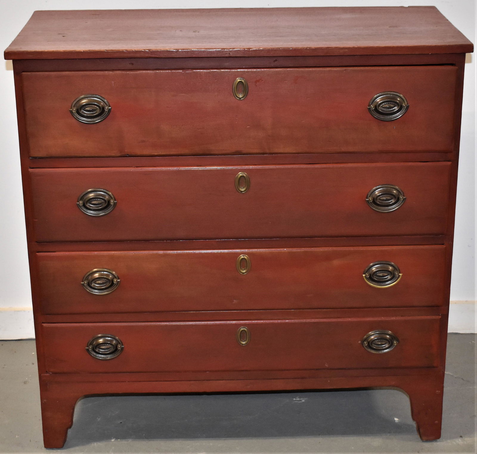 N. E. Country Hepplewhite 4 Draw Chest: N. E. COUNTRY HEPPLEWHITE 4 DRAWER CHEST IN LATER RED WASH ON HIGH BRACKET BASE W/ OVAL BRASSES - OLD REPAIRS, LATE WASH AND REPLACED BRASSES AND IMPERFECTIONS