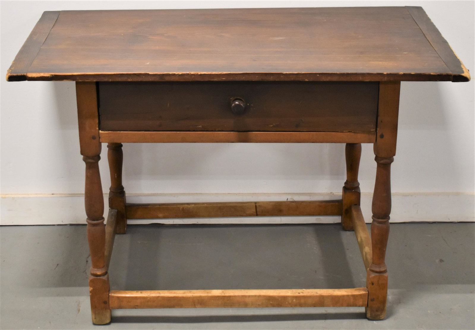 1 Drawer Maple and Pine Tavern Table: LATE 19TH EARLY 20TH CENTURY MAPLE AND PINE 1 DRAWER TAVERN TABLE W/ BOX STRETCHER BASE - PAINE FURNITURE COMPANY LABEL ON BOTTOM OF DRAWER - 25 1/2"T X 39 1/2" X 24"TOP - WEAR AND IMPERFECTIONS