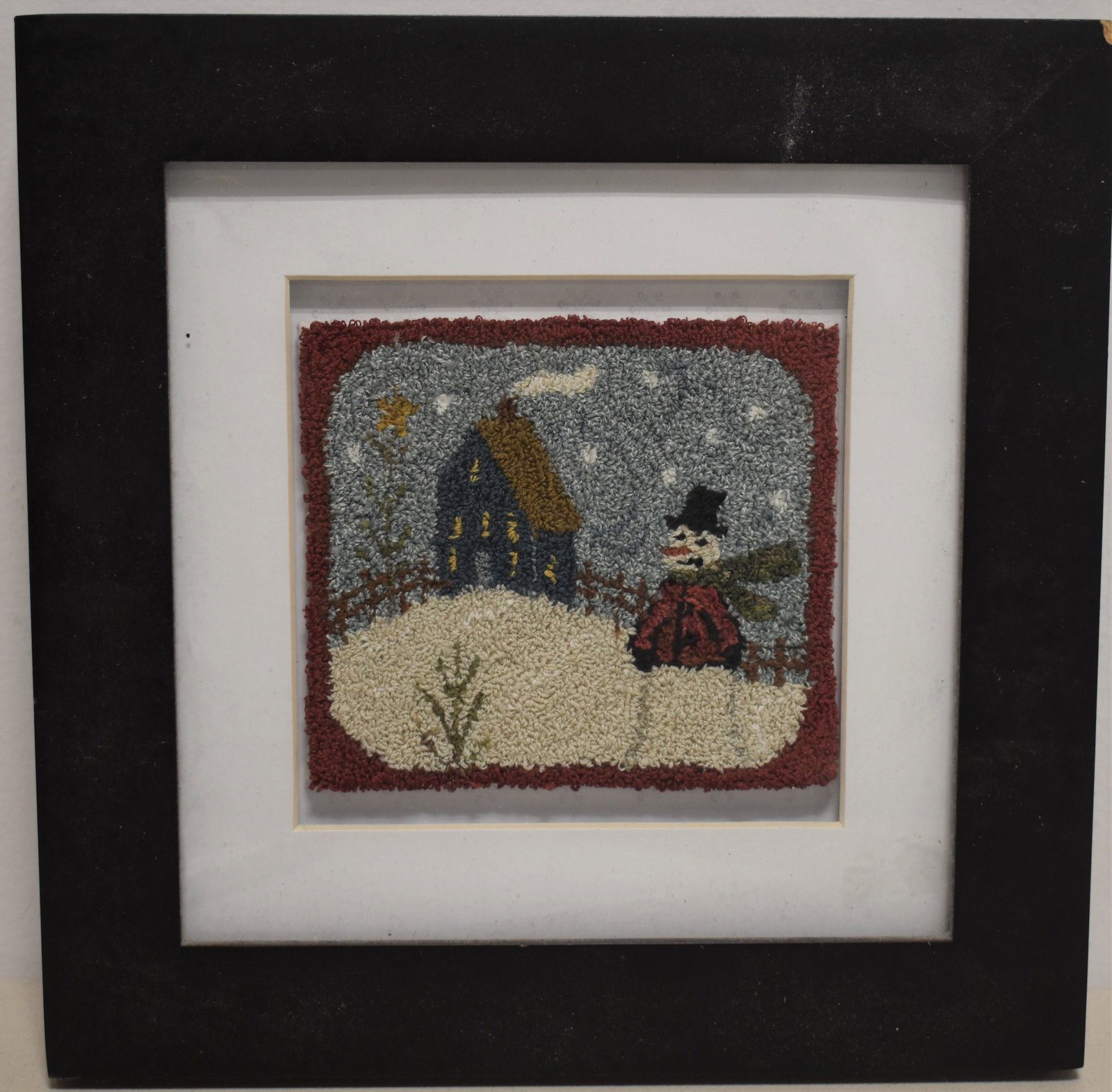 Small Figural Hooked Matte: 20TH CENTURY FIGURAL HOOKED MATTE OF WINTER SCENE W/ SNOWMAN AND COTTAGE - MOUNTED IN A FRAME W/ MATTE - 4 ½ X 5" - IMPERFECTIONS