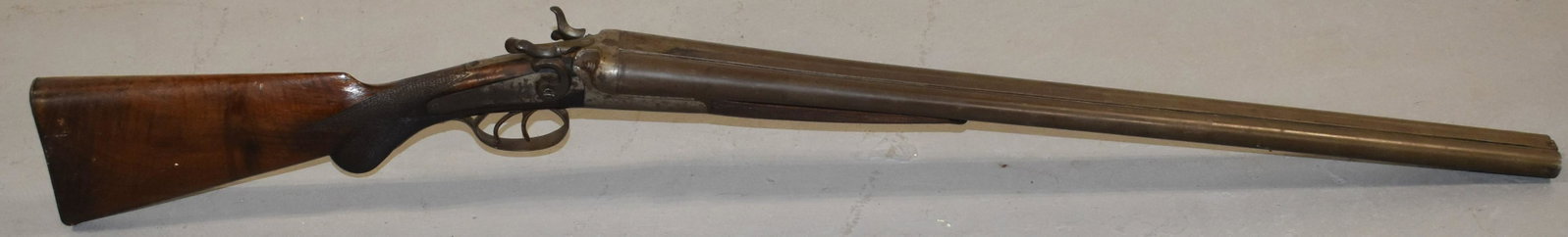 Janssen and Sons DBL Barrel Shot Gun: 19TH CENTURY DOUBLE BARREL SIDE BY SIDE 12 GA. SHOT GUN - TOP OF BARREL MARKS AND BELGIAN LAMINATED STEEL - BOTH LOCK PLATES MARKED JANSSEN SON'S AND CO - 44" L - BARREL 28 1/2 - WALNUT STOCK W/ SOME 