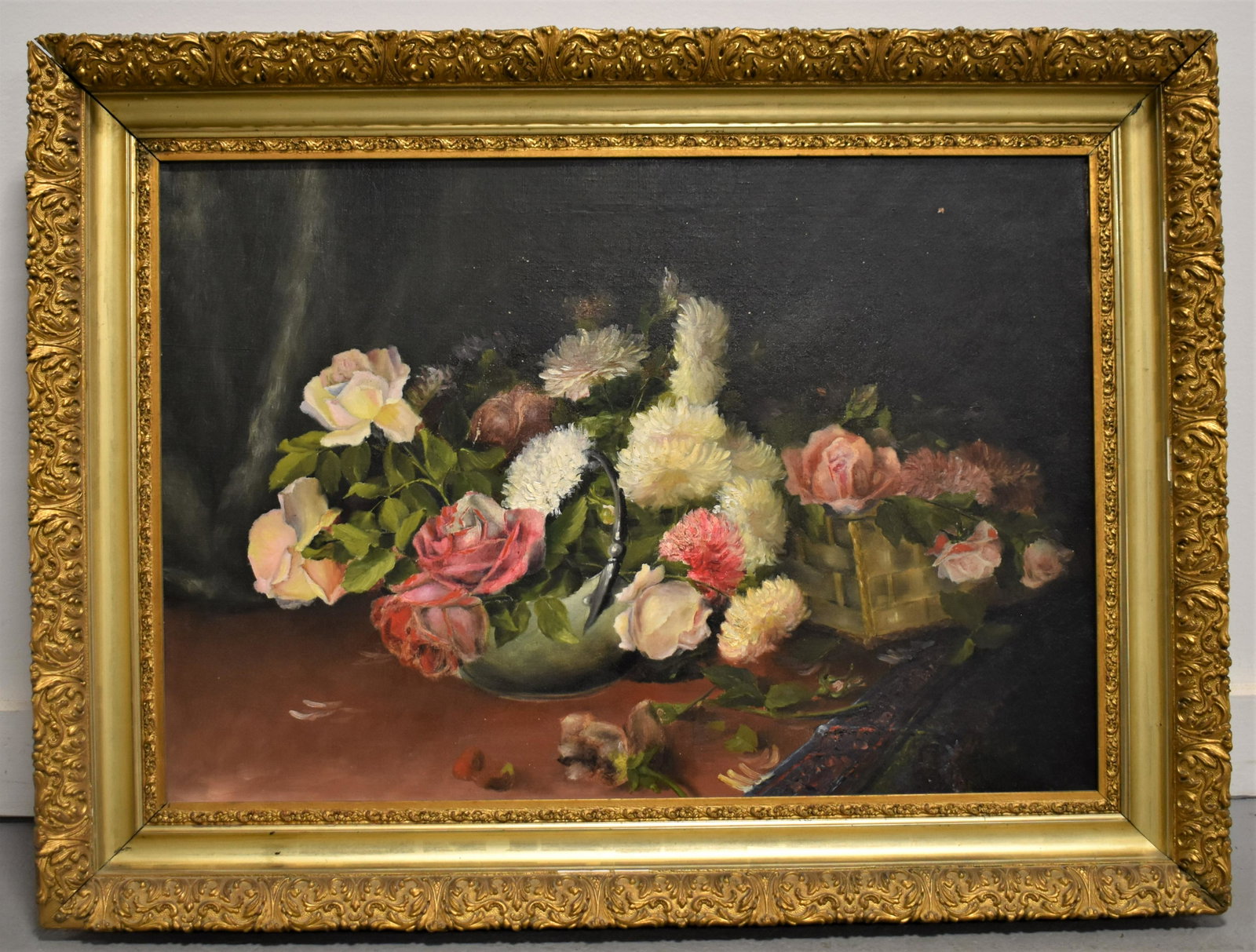 Floral Still Life Oil Painting: LATE 19TH CENTURY OIL PAINTING ON CANVAS OF ROSES AND CARNATIONS IN A HANDLED BOWL AND WOVEN BASKET- UNSIGNED IN A FANCY GILT FRAME - 17 1/2" X 25 1/2"- SIGHT SPOT LOOSE PAINT UPPER RIGHT, IMPERFECTIO