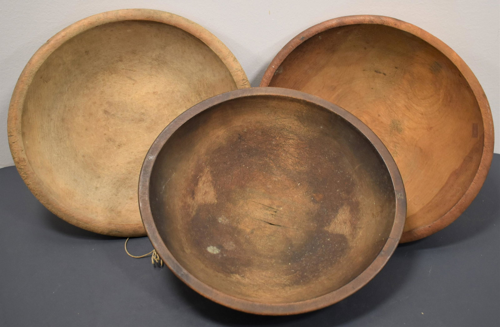 (3) Turned Round Wooden Chopping Bowls: LOT (3) ROUND MAPLE CHOPPING BOWLS IN OLD FINISH - 12 3/4" CRACKS IN BOTTOM - STAINING, 13" HOLE FOR HANGING AND 13" - WEAR AND IMPERFECTIONS