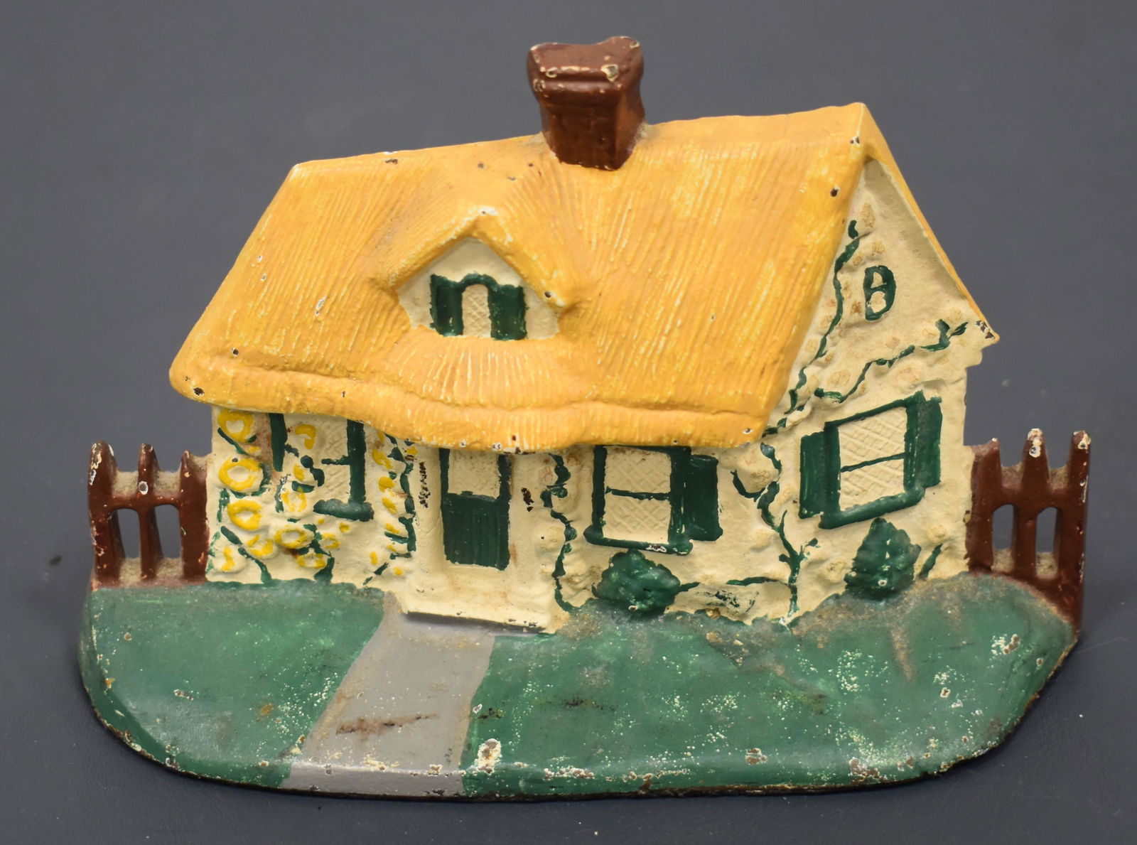 Vintage Cast Iron Cottage w/ Fence Doorstop (1 of 2)