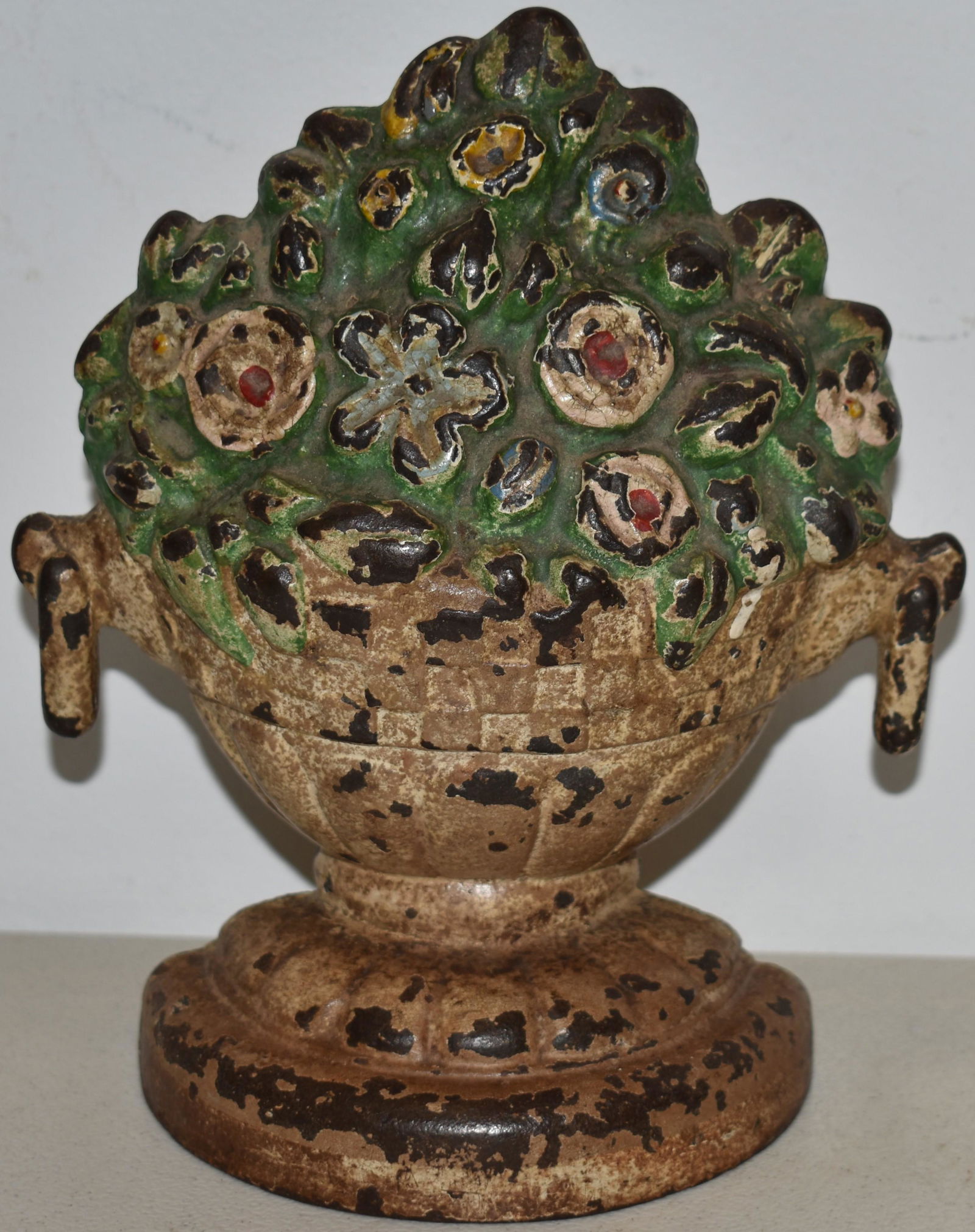 PAINTED CAST IRON URN OF FLOWER DOORSTOP (1 of 2)