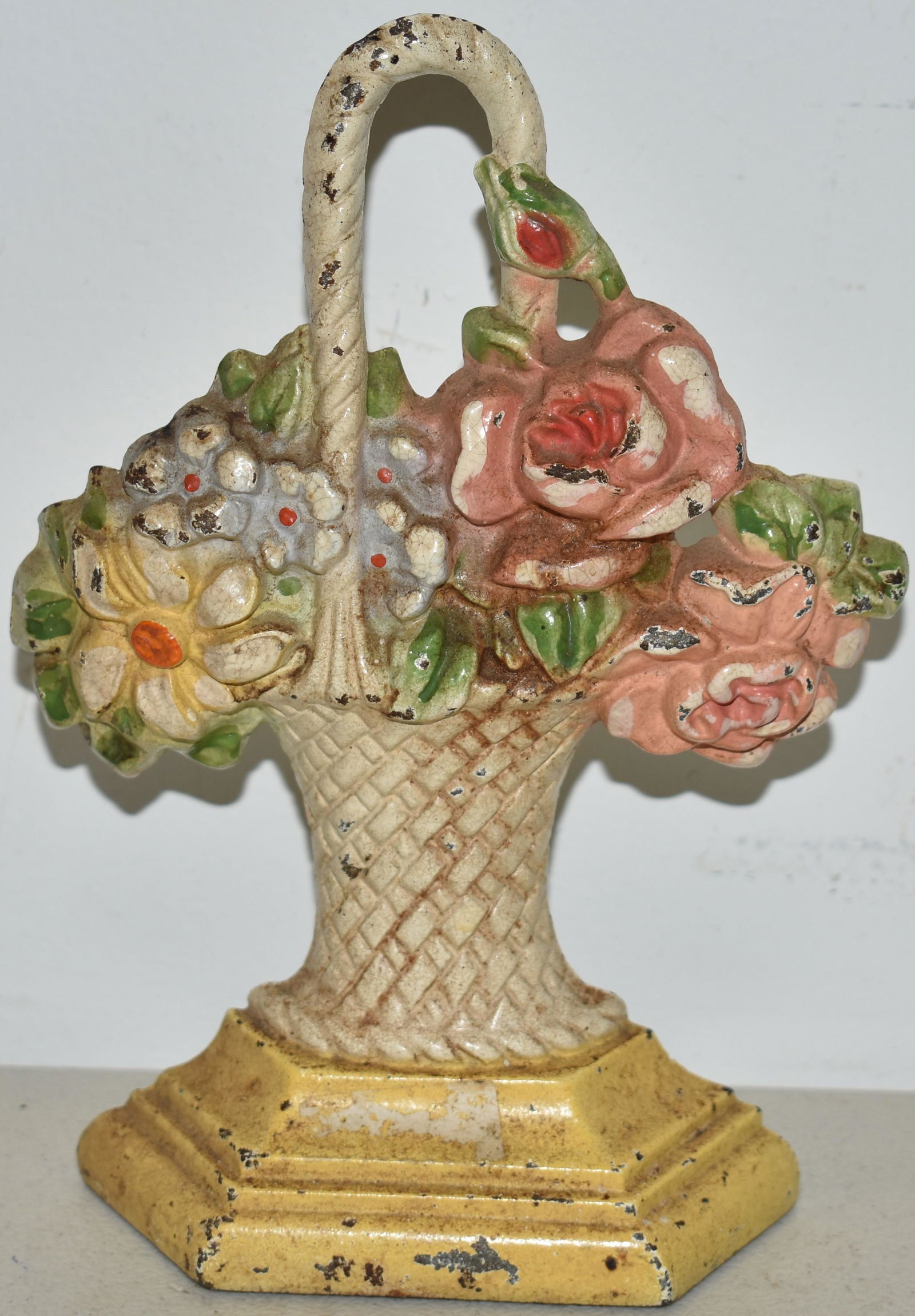 PAINTED CAST IRON BASKET OF FLOWERS DOORSTOP: 7 1/4" PAINTED CAST IRON BASKET OF FLOWERS DOORSTOP - HUBLEY #150 - WEAR & LOSSES TO PAINT, OXIDATION