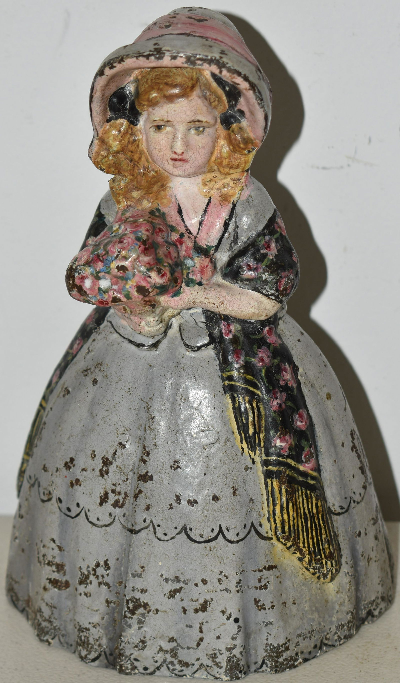 PAINTED CAST IRON GIRL WITH FLOWERS DOORSTOP (1 of 2)