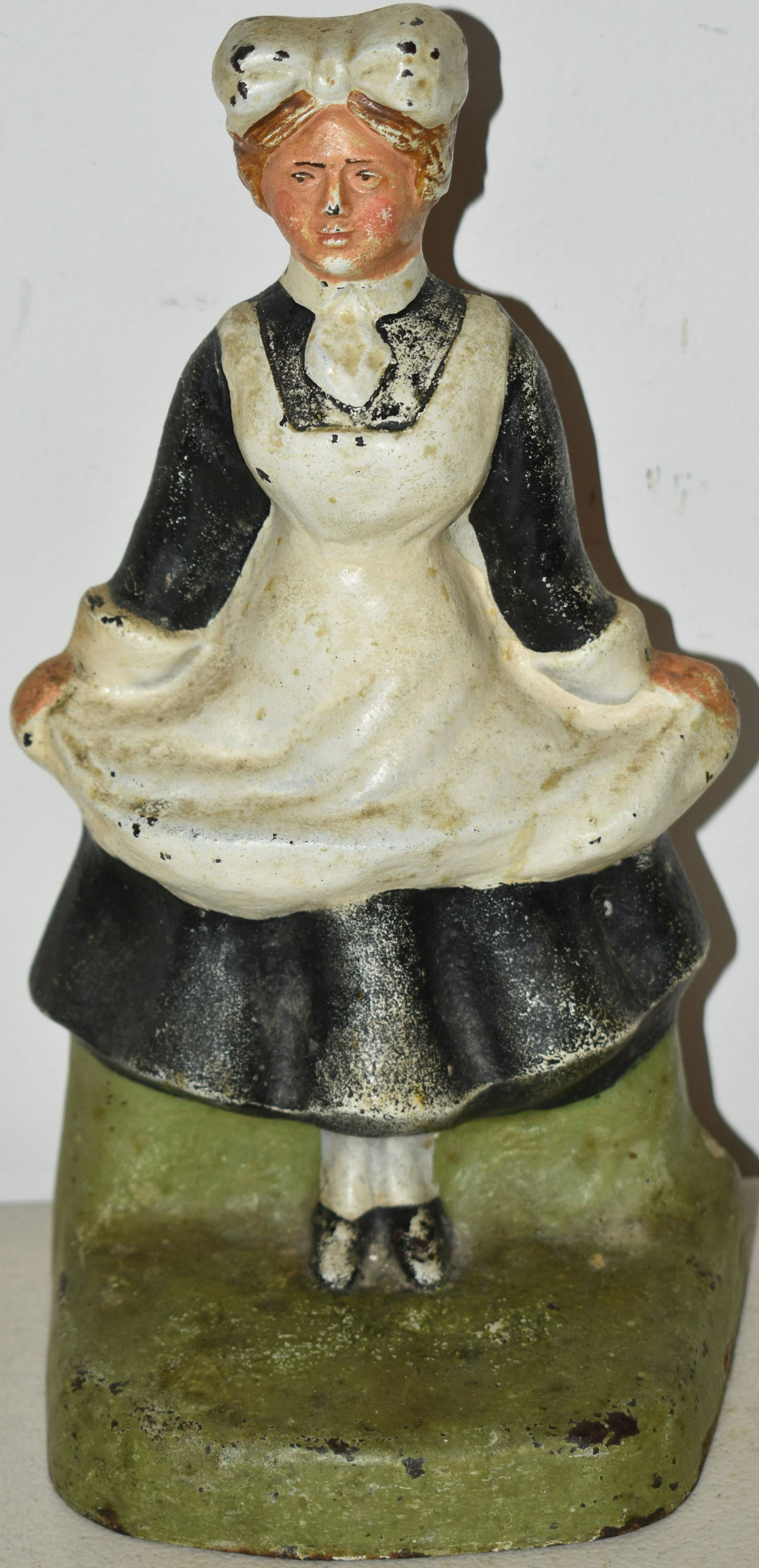 PAINTED CAST IRON MAID DOORSTOP: 8 3/4" PAINTED CAST IRON MAID DOORSTOP - CJO "1242" - WEAR & LOSSES TO PAINT, OXIDATION