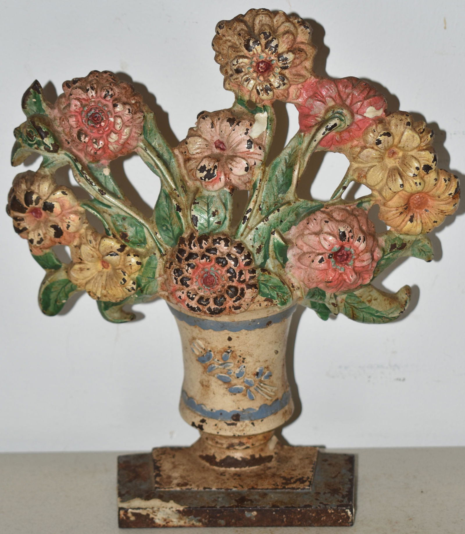 PAINTED CAST IRON URN OF ZINNIAS DOORSTOP (1 of 2)
