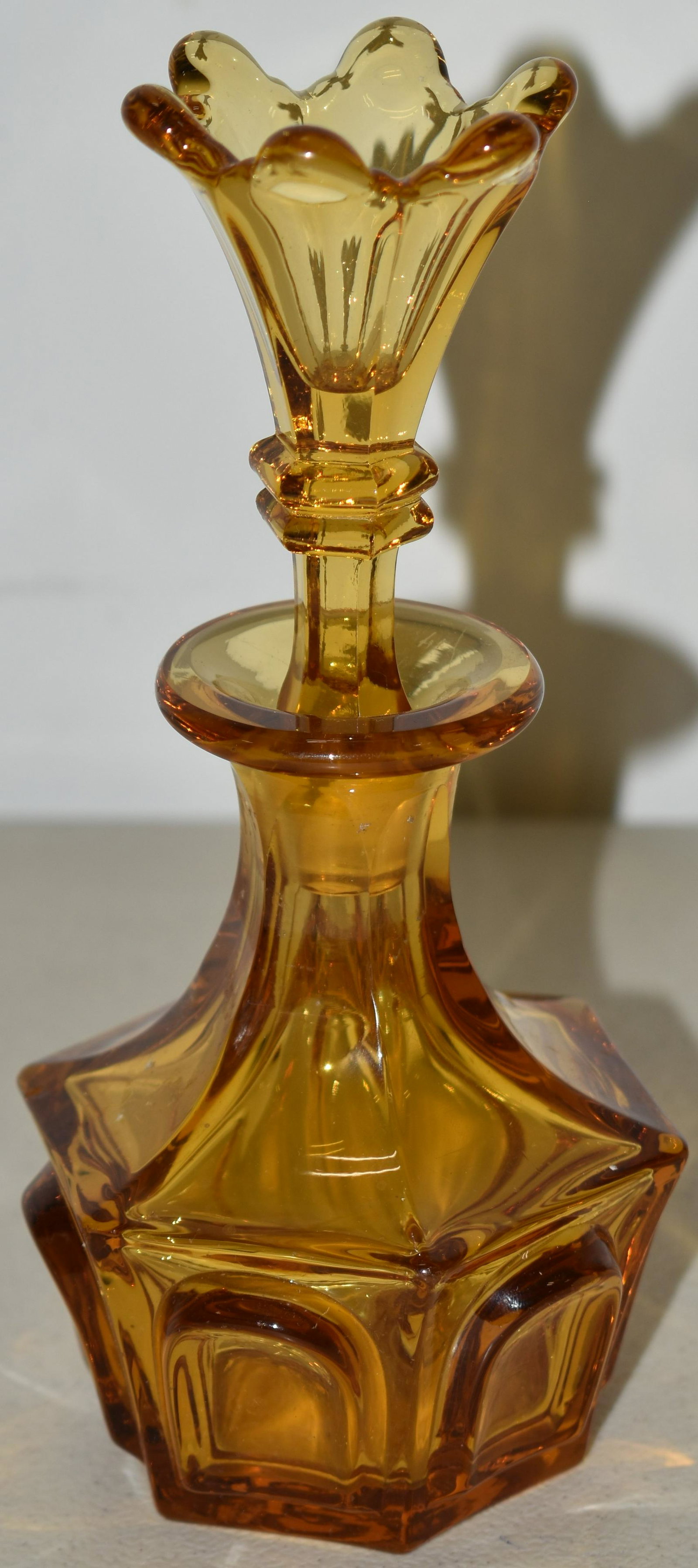 SANDWICH MOLDED COLOGNE W/ LILY STOPPER: 6 1/2" GOLDEN BRILLANT AMBER PANELED COLOGNE BOTTLE W/ LILY FORM STOPPER - SANWICH GLASS CO. - REF BARLOW - KAISER GLASS INDUSTRY IN SANDWICH P. 116? - IMPERFECTIONS