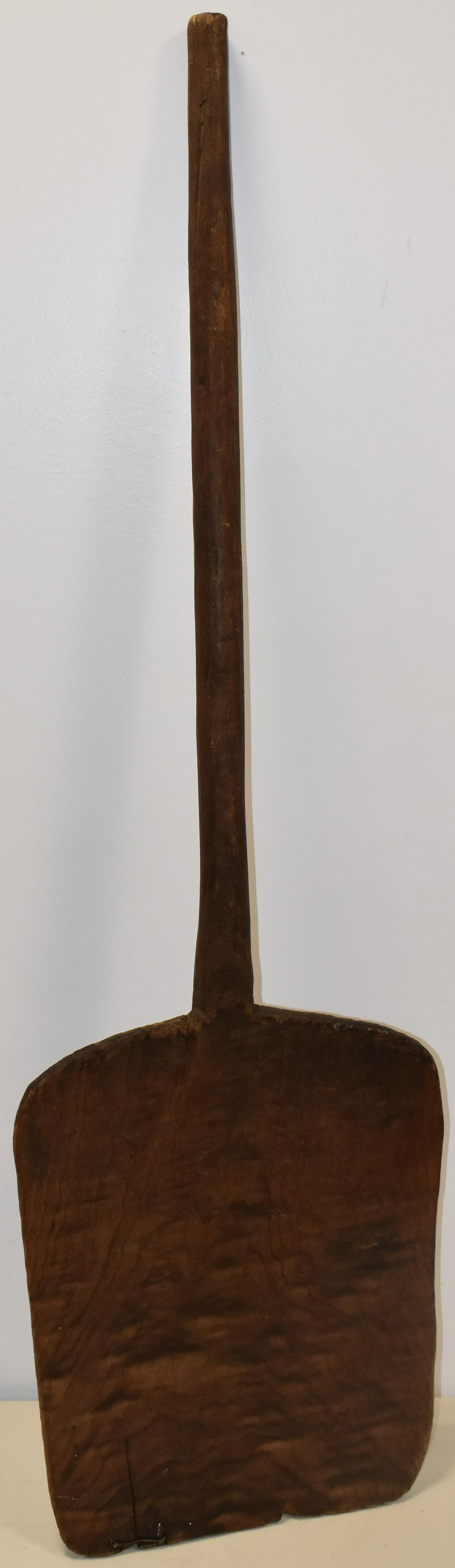 19TH CENT 1 PIECE WOODEN SHOVEL: 19TH CENT PRIMITIVE 1 PIECE 47" WOODEN SHOVEL - BLADE 17" L X 13 1/2" - W/ HANDLE 30" - ALL CARVED FROM SINGLE PIECE OF WOOD - NATURAL FINISH - CRACKS, WEAR & IMEPRFECTIONS