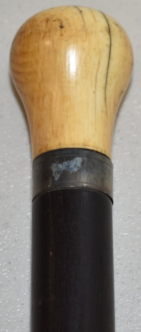35" EBONY CANE W/ CARVED HANDLE (1 of 2)