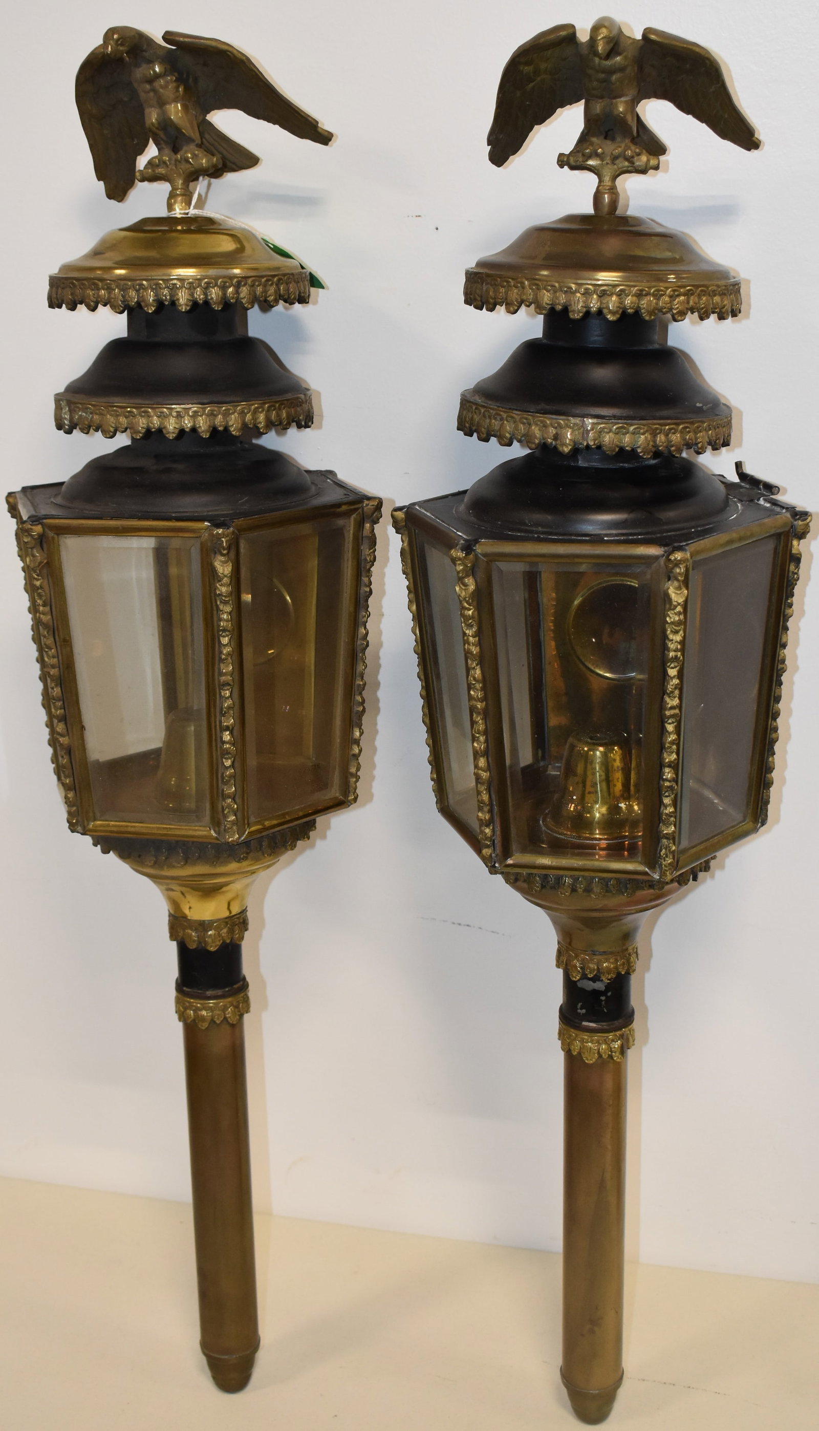 PR. ENGLISH CARRIAGE LANTERNS W/ EAGLES: PR. LATE 19TH CENT BRASS CARRIAGE LANTERNS W/ BEVELED GLASS PANELS & FULL FIGURED EAGLE FINIALS - 33 1/2" L - ONE GLASS PANEL MARKED MADE IN ENGLAND - WEAR & IMPERFECTIONS