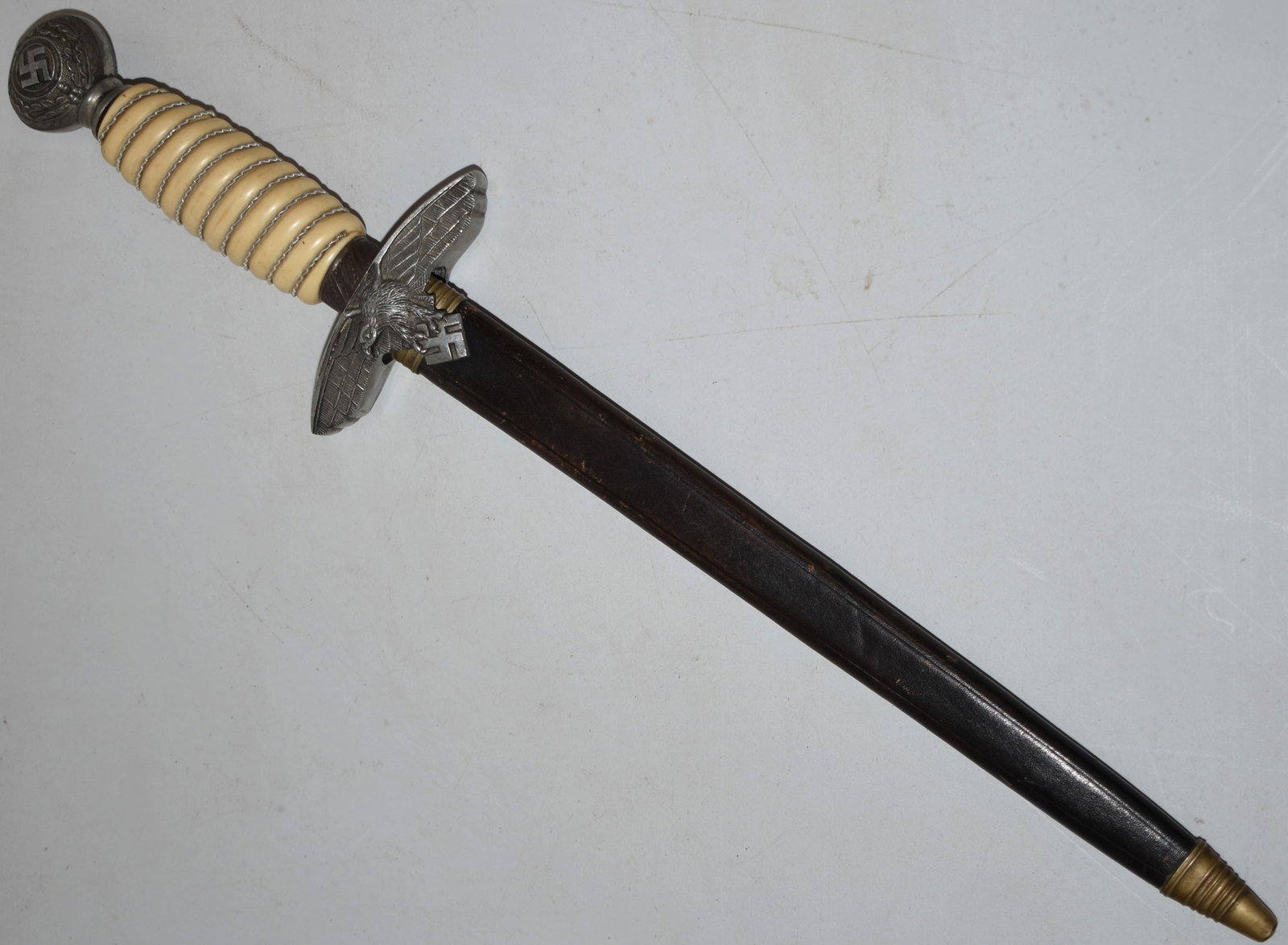 GERMAN NAZI DRESS DAGGER W/ IVORY HANDLE: WWII VINTAGE 15 1/4" NAZI GERMAN DRESS DAGGER W/ EAGLE & SWATIKA GAURD & WRAPPED IVORY HANDLE - BLADE MARKED SOLINGEN GERMANY 1939 B& & A - W/ BROWN LEATHER SCABBARD - IMPERFECTIONS