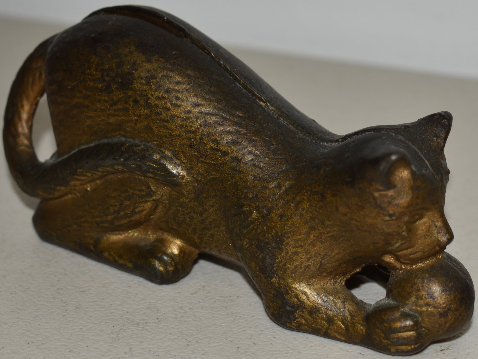 CAST IRON CAT CHASING BALL STILL BANK: VINTAGE PAINTED CAST IRON FIGURAL CAT CHASING BALL OF STRING STILL BANK - 5 1/2" L X 2 1/2" T - WEAR