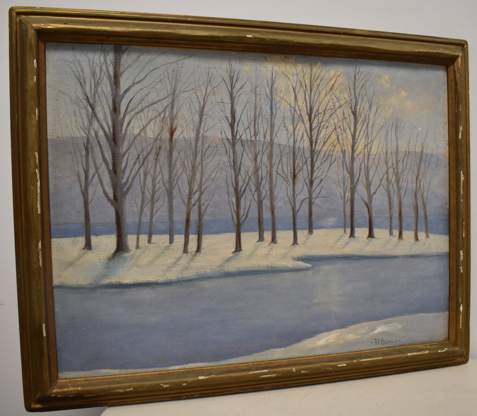 OIL ON CANVAS BOARD WINTER LANDSCAPE PAINTING: 20TH CENT OIL PAINTING ON CANVAS BOARD OF A WINTER LANDSCAPE - SIGNED R.F. BURNS '37 LOWER RIGHT - 17 1/4" X 23 1/2" SIGHT - WEAR TO FRAME & IMPERFECTIONS