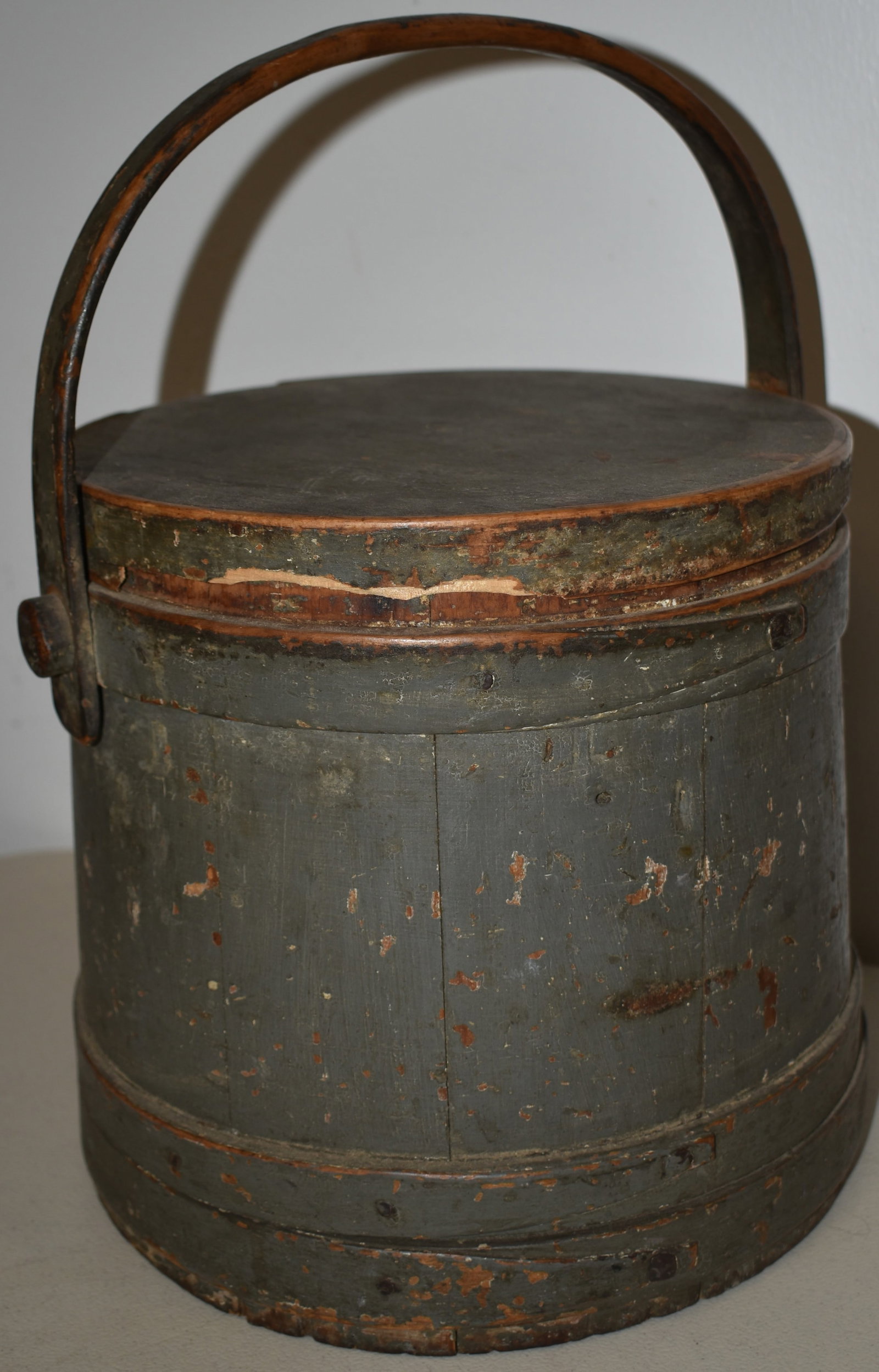 19TH CENT PAINTED WOODEN FIRKIN: 19TH CENT N.E. PAINTED WOODEN FINGER BANDED FIRKIN W/ WOODEN BAIL HANDLE IN OLD GREY PAINT - BUCKET 9" T X 9 1/2" D - 13 1/2" T W/ HANDLE - LOSSES TO RIM OF OF TOP - WEAR & IMPERFECTIONS