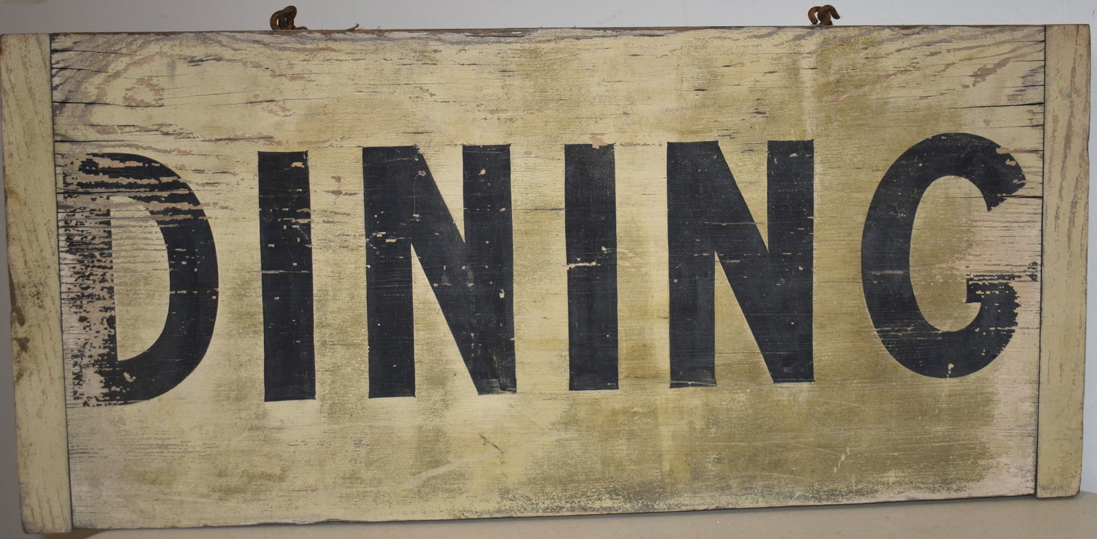 VITNAGE PAINTED WOODEN DINING SIGN: VINTAGE MID 20TH CENT PAINTED WOODEN SIGN - WHITE W/ BLACK LETTERING - " DINING" W/ BREADBAORD ENDS - 22 1/4" L X 10" W - SINGLE SIDED - WEAR & IMPERFECTIONS