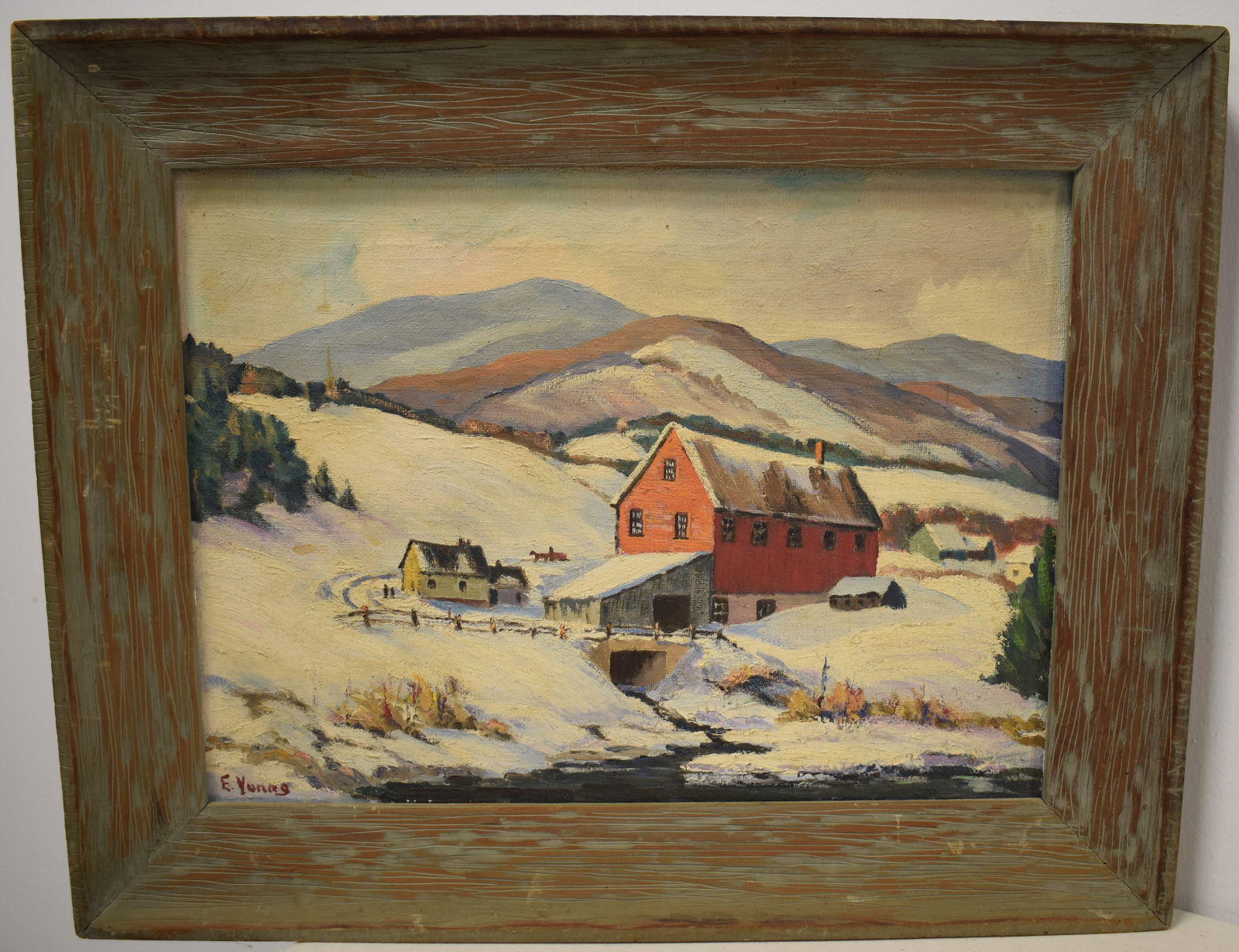 WINTER LANDSCAPE OIL PAINTING: 20TH CENT OIL ON CANVAS OF A WINTER LANDSCAPE W/ YELLOW HOME & LARGE RED BARN W/ MOUNTAIN LANDSCAPE IN THE FOREGROUND - SIGNED E. YOUNG LOWER RIGHT - TITLED SCENE FROM BALDWINVILLE VT NO. 7 ON BACK ST