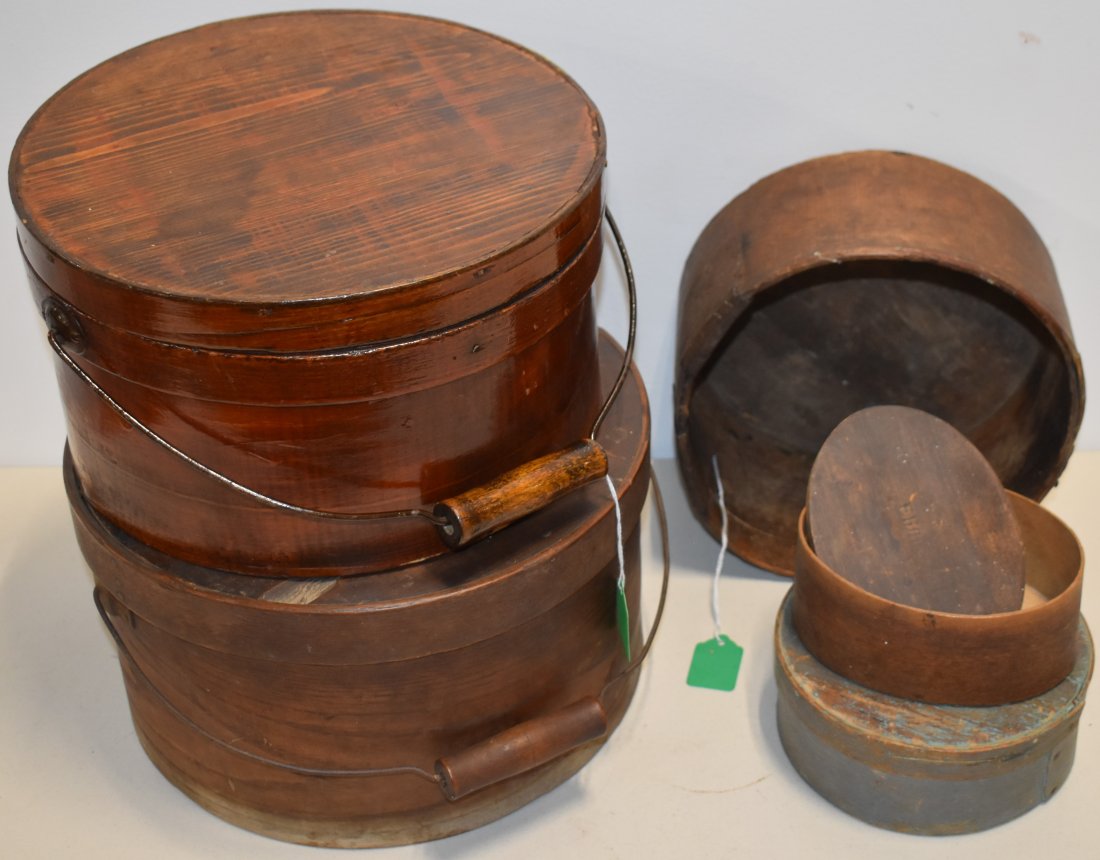 LOT WOODEN BANDED PANTRY BOXES: (4) 19TH CENT WOODEN PANTRY BOXES - (2) ROUND PANTRY BOXES W/ WIRE & WOODEN BAIL HANDLES 11" & 12" - 6 1/2" ROUND BANDED PANTRY BOX IN OLD BLUE GREEN PAINT & 5 3/4" OVAL BANDED PANTRY BOX - STAMPED NA