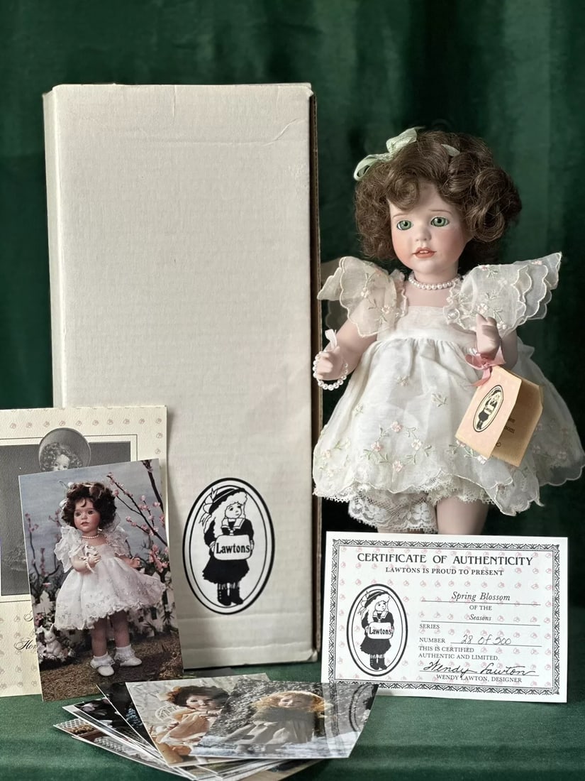 Wendy Lawton “Spring Blossom" 13" Porcelain Doll Box/Tag/COA LE 500: Porcelain 13” doll by Wendy Lawton. She is all porcelain. Package dimensions: 16"-12"-8"