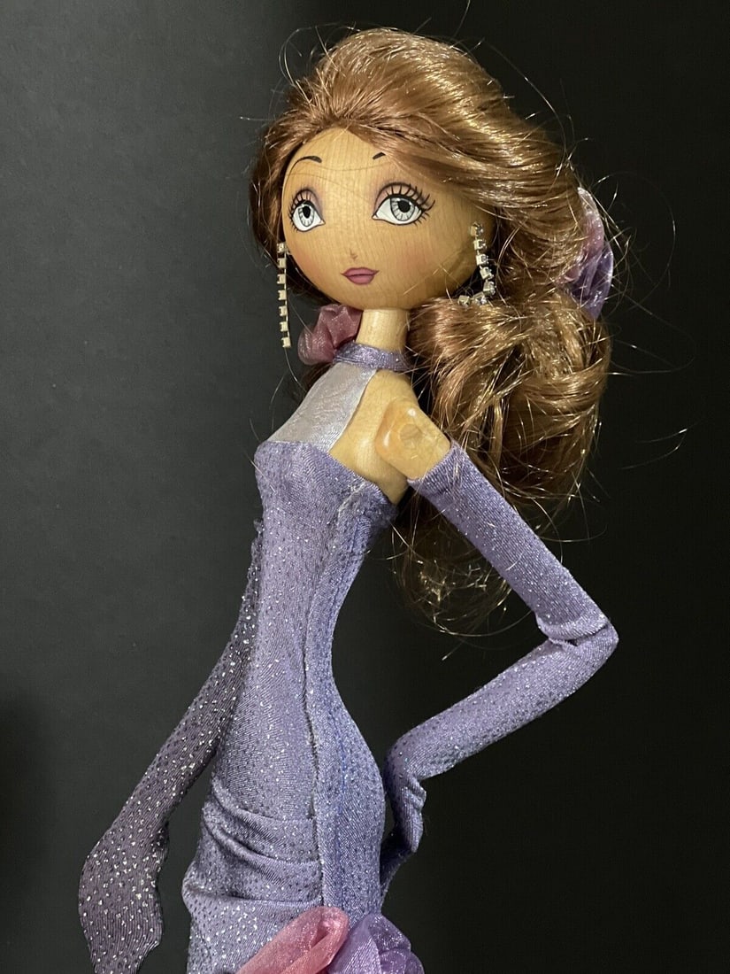 Xenis Collection Diva Series “Rosalyn" # 75009 Wooden 21" Doll Figurine: Beautiful hand carved doll created by Marlene and Tania Xenis out of Canadian maple. She is about 21” tall.This Diva doll (like any other Xenis Diva dolls ) has a trademark carved swirl at the b