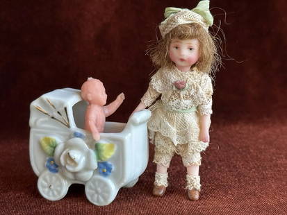Artist Signed 3" Polymer Clay (?) Miniature Dollhouse Doll with Accessories: This adorable little doll is signed on the back, but it is covered by the clothes and we can’t read it. There is also a tag attached to the doll. She is in great condition. The doll is beautifully m