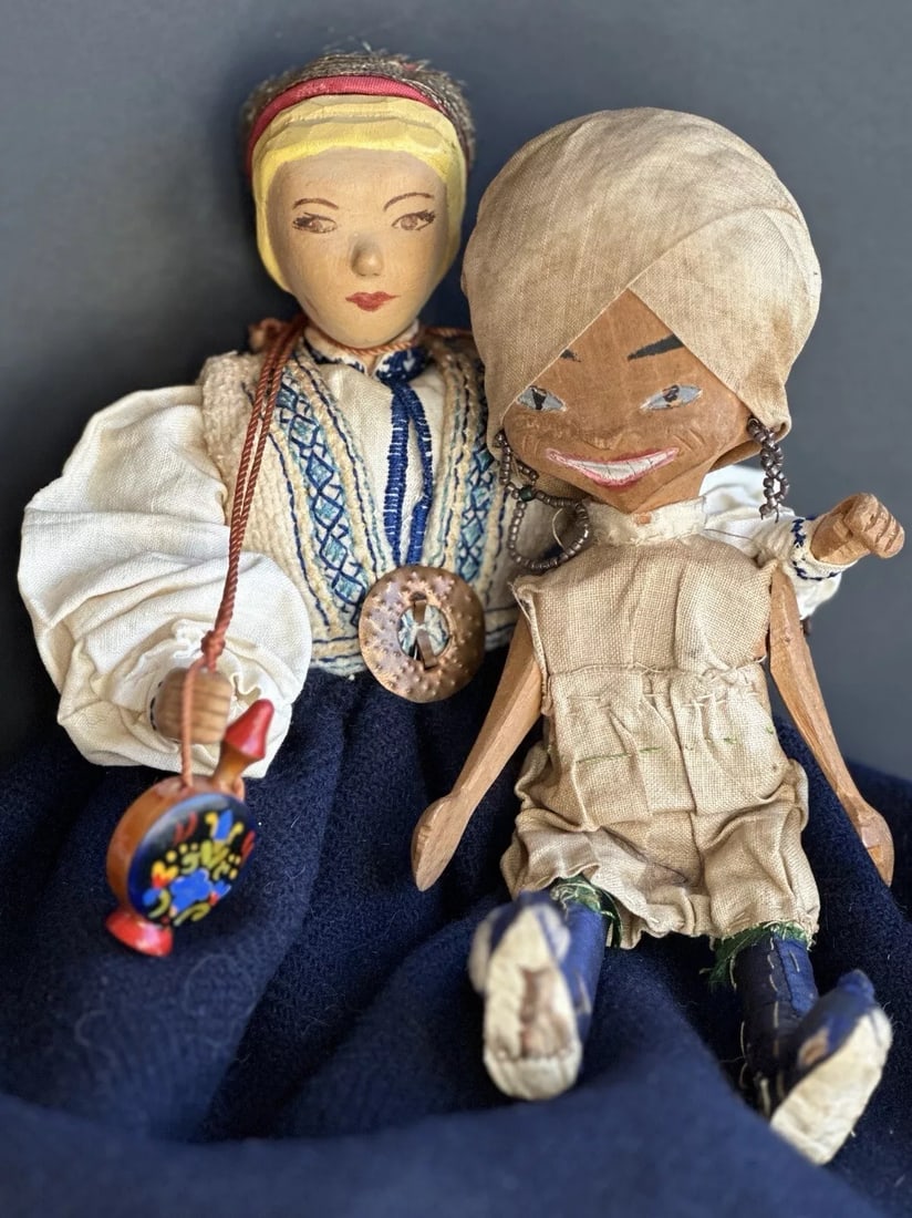 Lot of 2 Unidentified Vintage Hand Carved Jointed Wooden Dolls: Very sweet collectible wooden dolls that most likely came to United States from other countries. They are 10” and 7” tall. All parts of the dolls are wood. They are jointed, including the 
