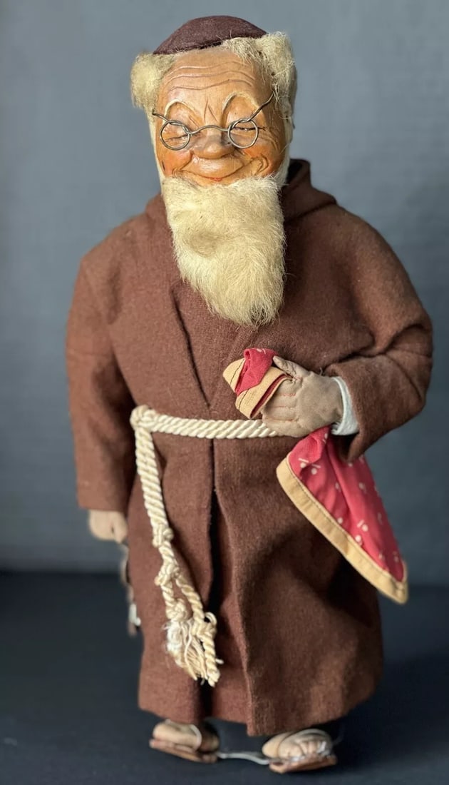 Antique(?) French (?) Wooden Carved Monk Bottle 12" Doll Handmade (?): Very unique doll/figurine!!!He is about 12” tall. His head is made of carved wood is placed over a bottle that inserted into the fabric base. His hands and feet are made of cloth as well. Nicely