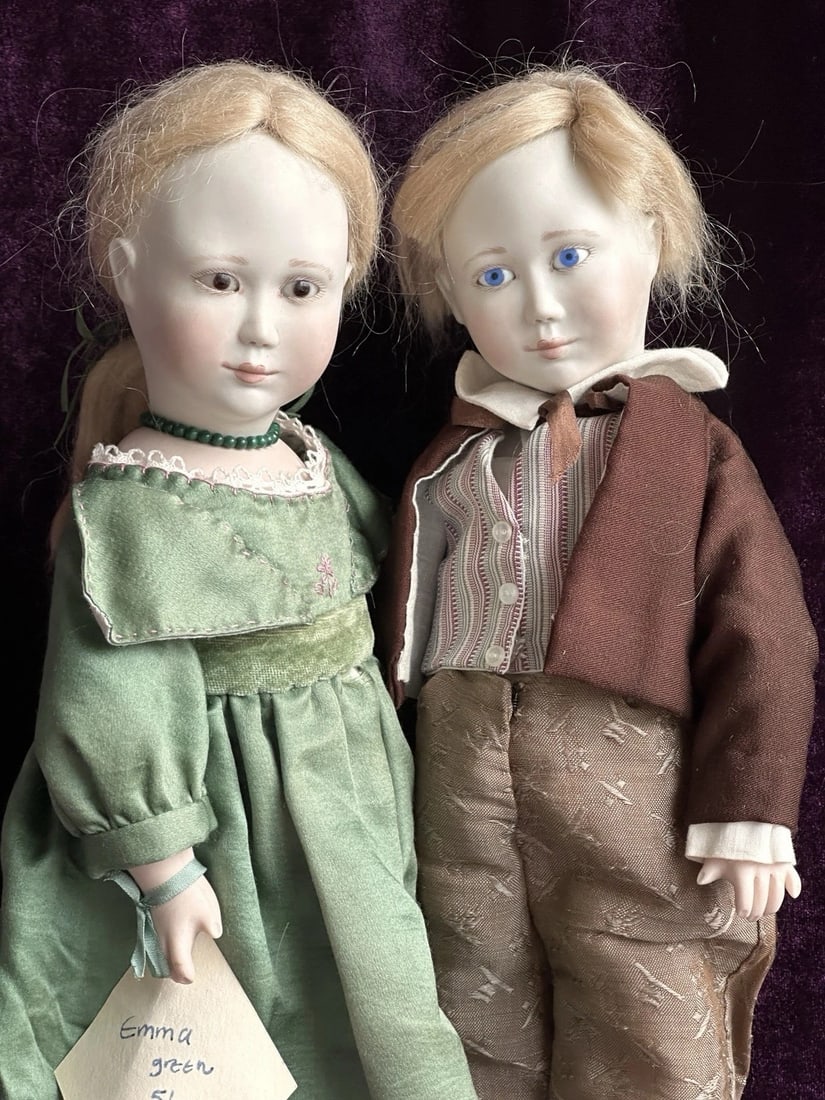 2 Rare Vintage All Porcelain Dolls by Lynne & Michael Roche James & Emma LE 25: Hard to find sweet dolls by famous artists. The dolls are approximately 13.5” tall. They are all original. Made of porcelain with wooden ball joints. The only flaw to the dolls is to the upper l