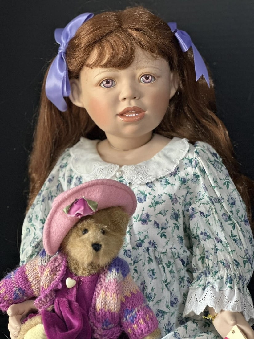 Lifelike 28" Collectible Porcelain Doll “Adela by Christine Orange LE 500: Porcelain head and shoulder plate, partial extremities. The rest of her body is stuffed cloth with armature inside.No odors of any kind are present.Adela has a light red hair and pink eyes.No box or C