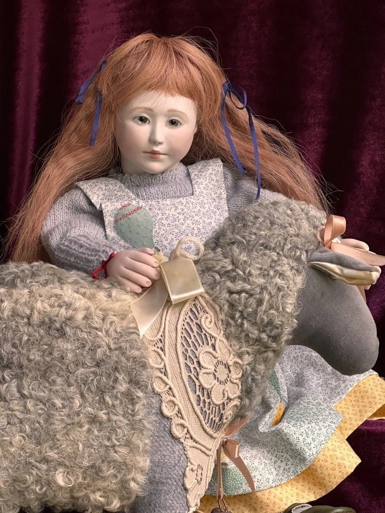 Large Collectible 20" Wooden/Porcelain Lynne & Michael Roche Claudine LE Doll: This very pretty doll is all original and is coming with tag! She is in a great condition and clean. No damage to the doll. She has porcelain head and hands and the body is ball jointed wood. Good str