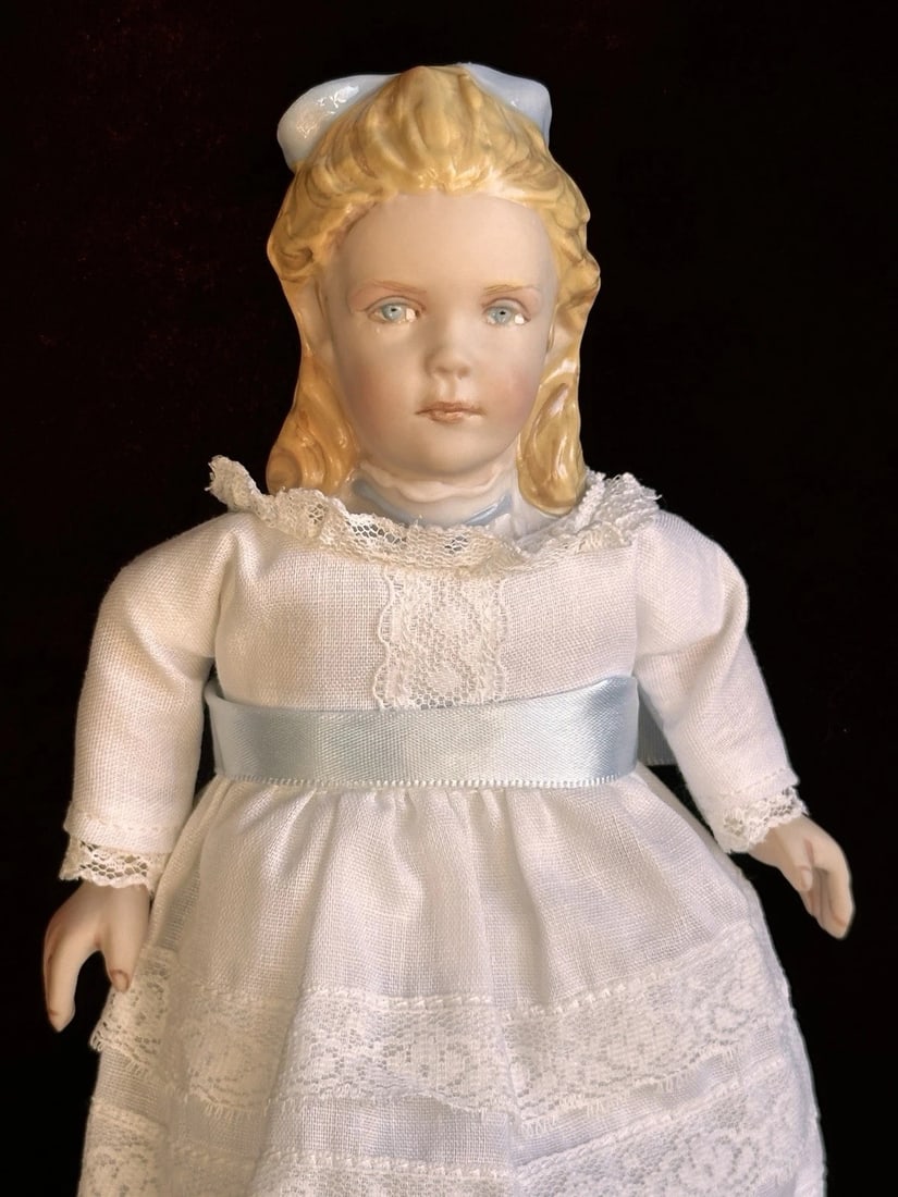 UFDC Artist Kathy Redmond 9" Porcelain Alice Doll: Beautifully made doll in great condition. She has no damage and is clean. The doll has porcelain head and porcelain lower legs and hands. The rest is cloth.Please refer to the pictures for more detail