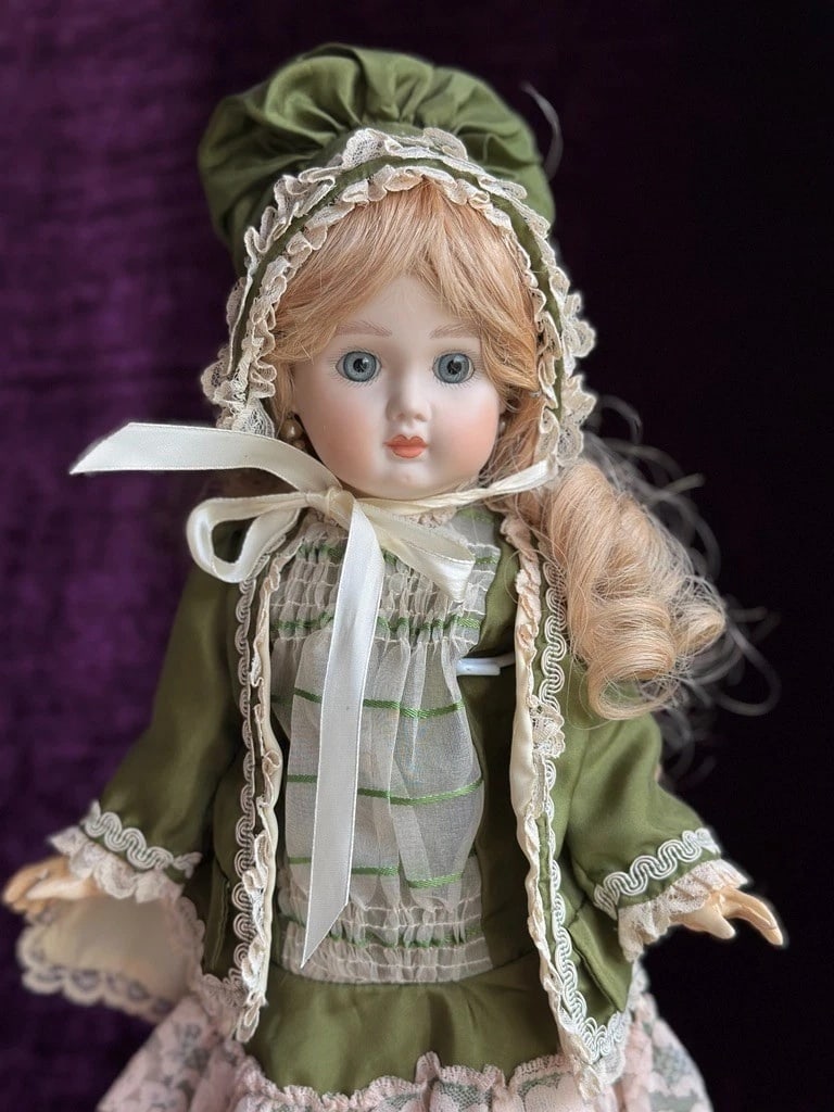Vintage 17" Porcelain Composition Reproduction of Antique French Steiner Doll: This sweet old doll is in good condition with no damage. The head is made of porcelain, and the rest of the body is composition. She is signed and dated by the artist.The doll has a beautiful human ha