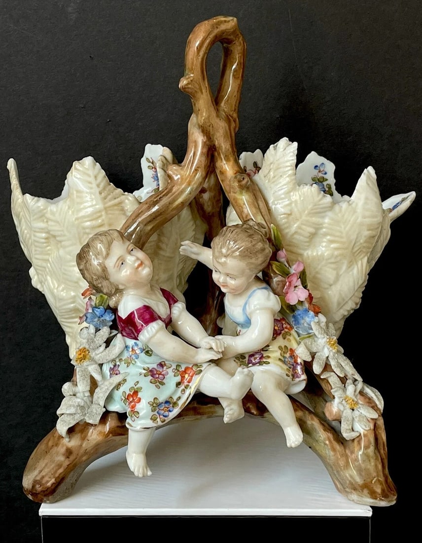 Antique Early(?) Rudolstadt Volkstedt German Porcelain Figurine Cracked Egg Vase: Original Rudolstadt Volkstedt antique porcelain figurine.SIZE:This figurine is about 6.5" tall from the bottom of the top of the vase. The widest part of figurine is about 6.5" as well.MARKS:- Figurin