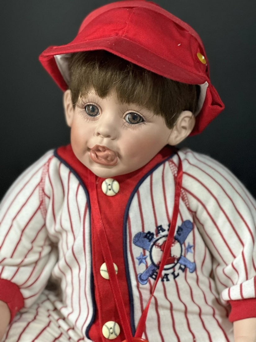 Collectible Porcelain 22" Doll "Bubba Bo Slugger" by Fayzah Spanos LE 1000: Cute little guy doll by Fayzah Spanos!He is a limited edition of 1000 dolls.Bubba Bo Slugger is approximately 22" tall considering bent knees and about 13" in a sitting position. Has to be displayed i
